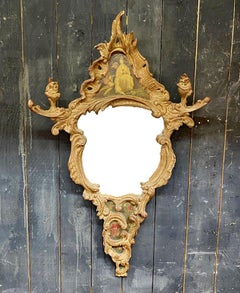 A scrolled mirror in carved and patinated molded wood painted with chinese  XIXè