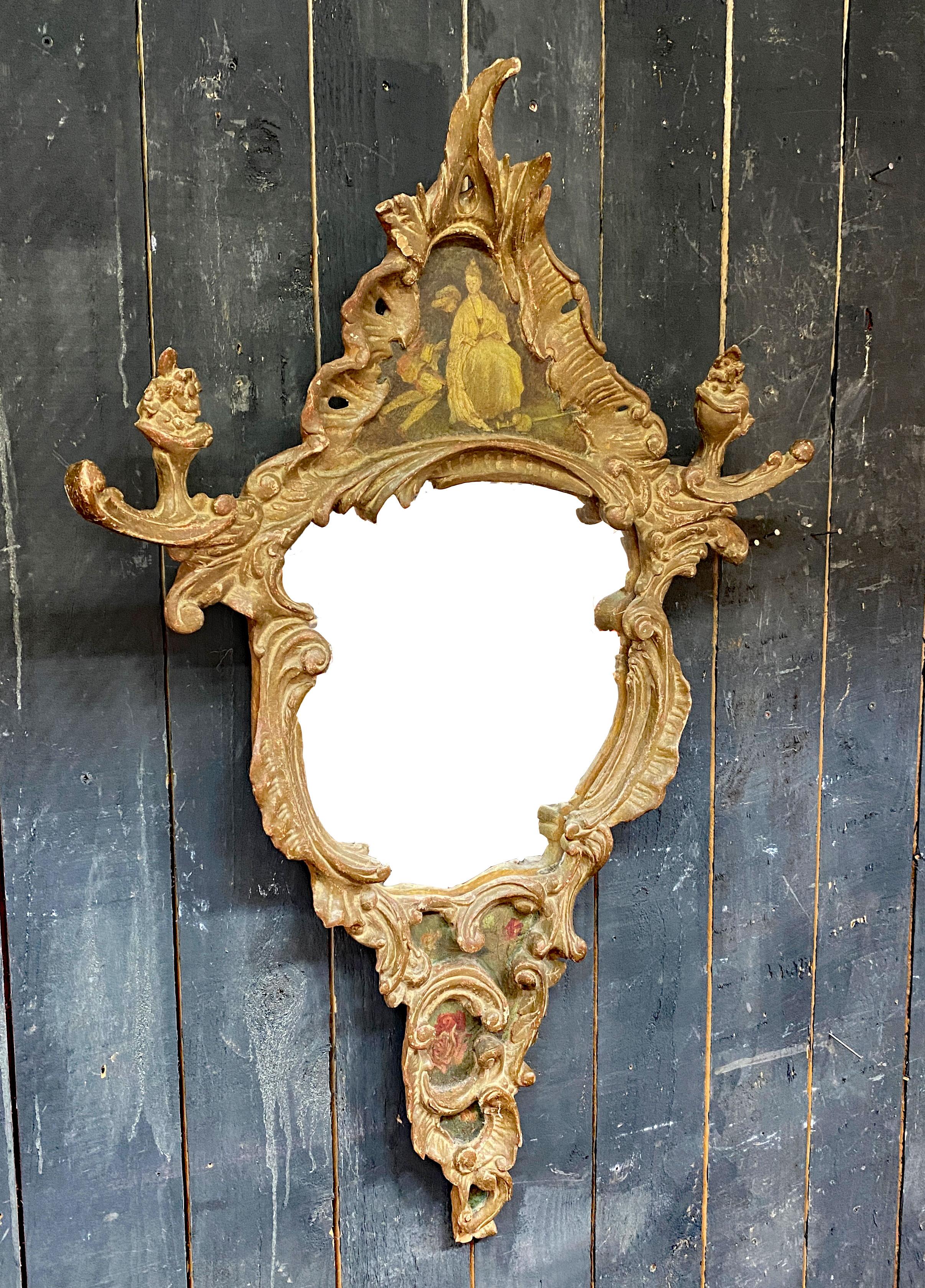 French A scrolled mirror in carved and patinated molded wood painted with chinese  XIXè For Sale