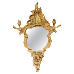 A scrolled mirror in carved and patinated molded wood painted with chinese  XIXè