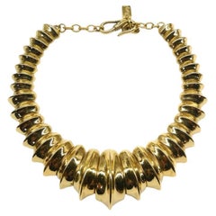 Used A sculpted gilt metal necklace, Yves Saint Laurent, France, 1980s