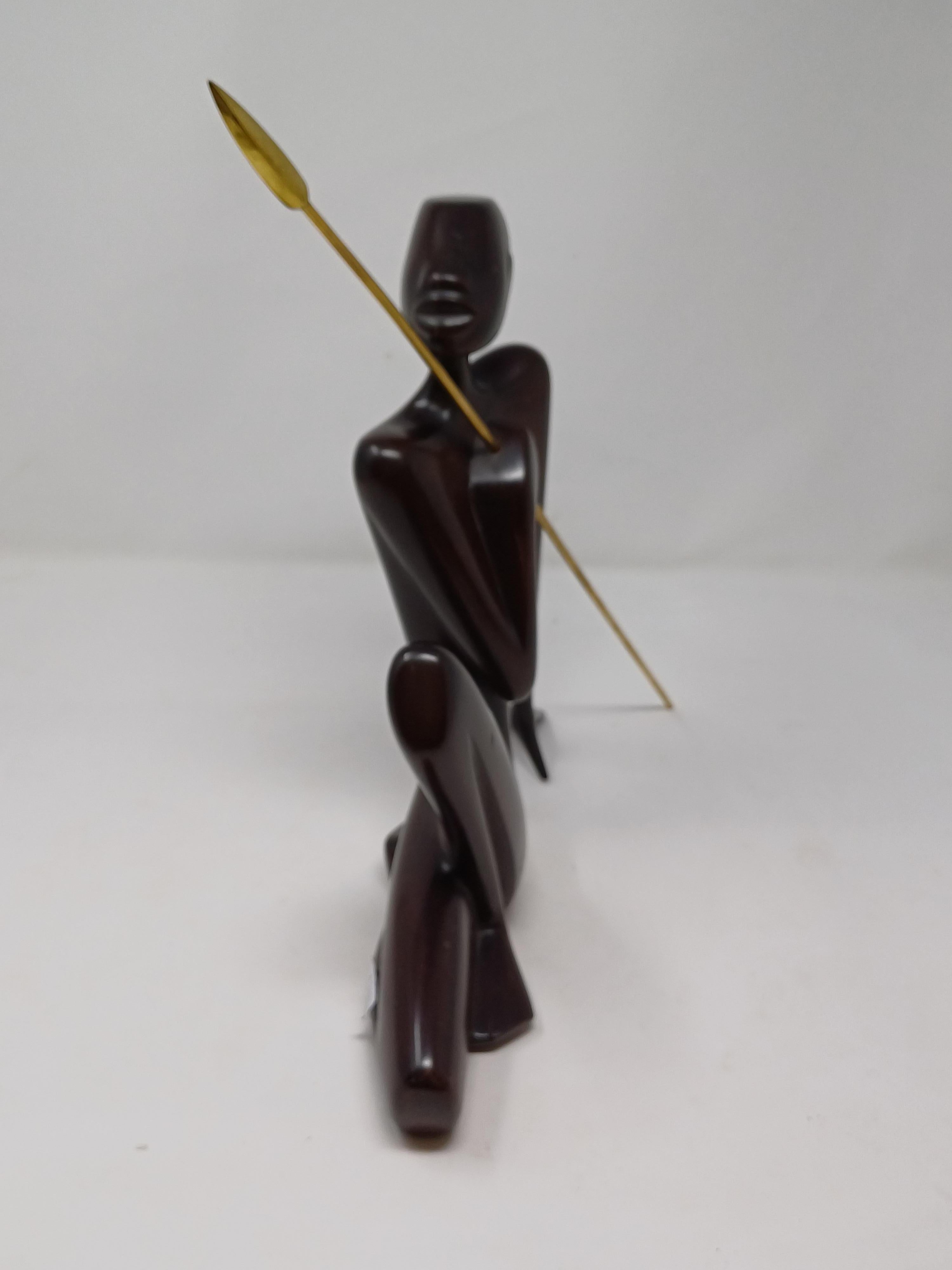 Austrian A sculpted wooden figure of an african warrior by Karl Hagenauer