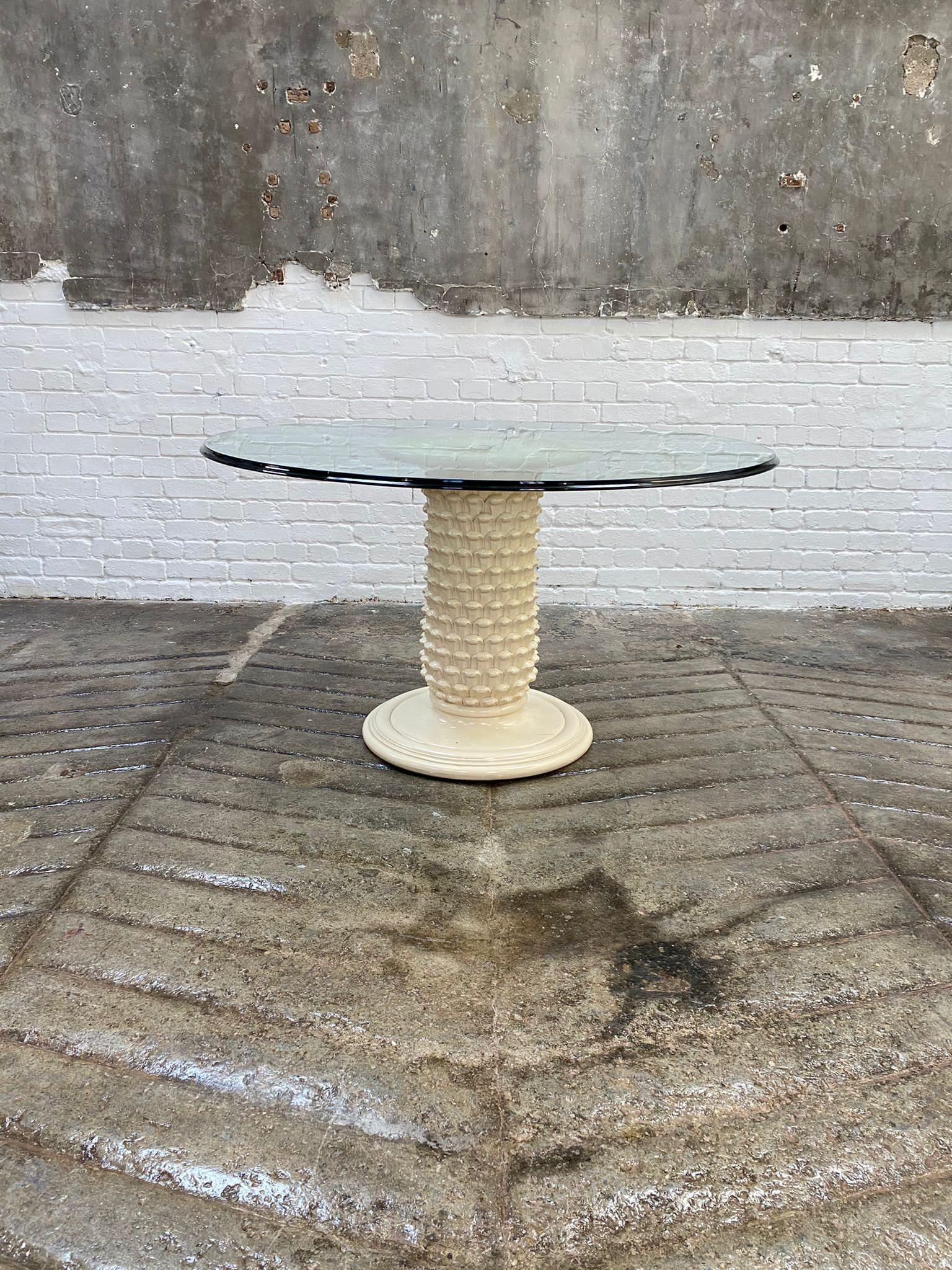 This dramatic sculptural table has a matte cream/white finish, a lacquer on wood, with a removable beveled clear glass top. In the manner of Serge Roche or Dorothy Draper. This cool piece sits six people, or would make a wonderful centre table in