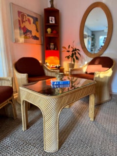 A sculptural set of three mid century modern rattan club chairs