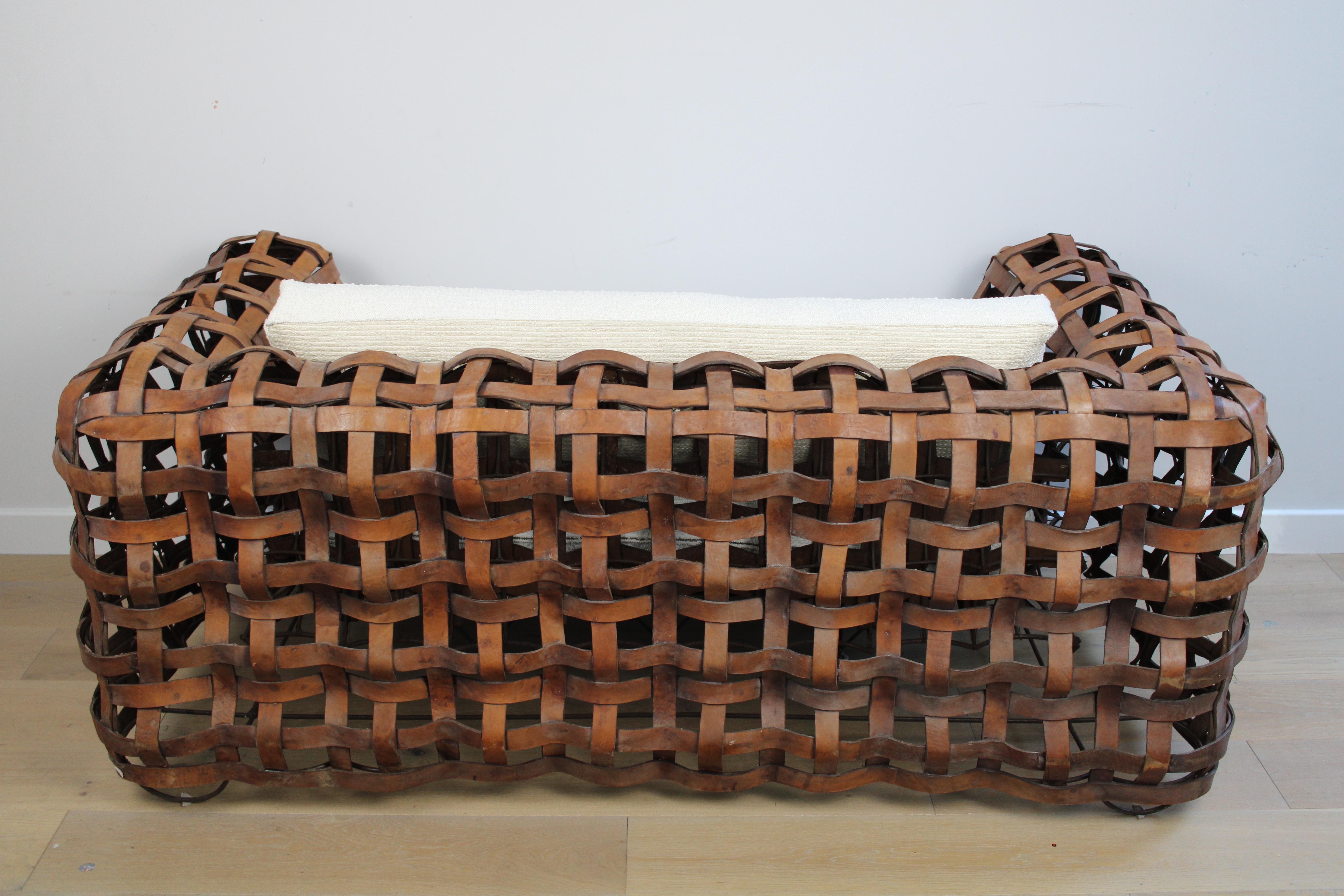 Bohemian A sculptural Vintage woven leather strap sofa with feather cushions in boucle For Sale