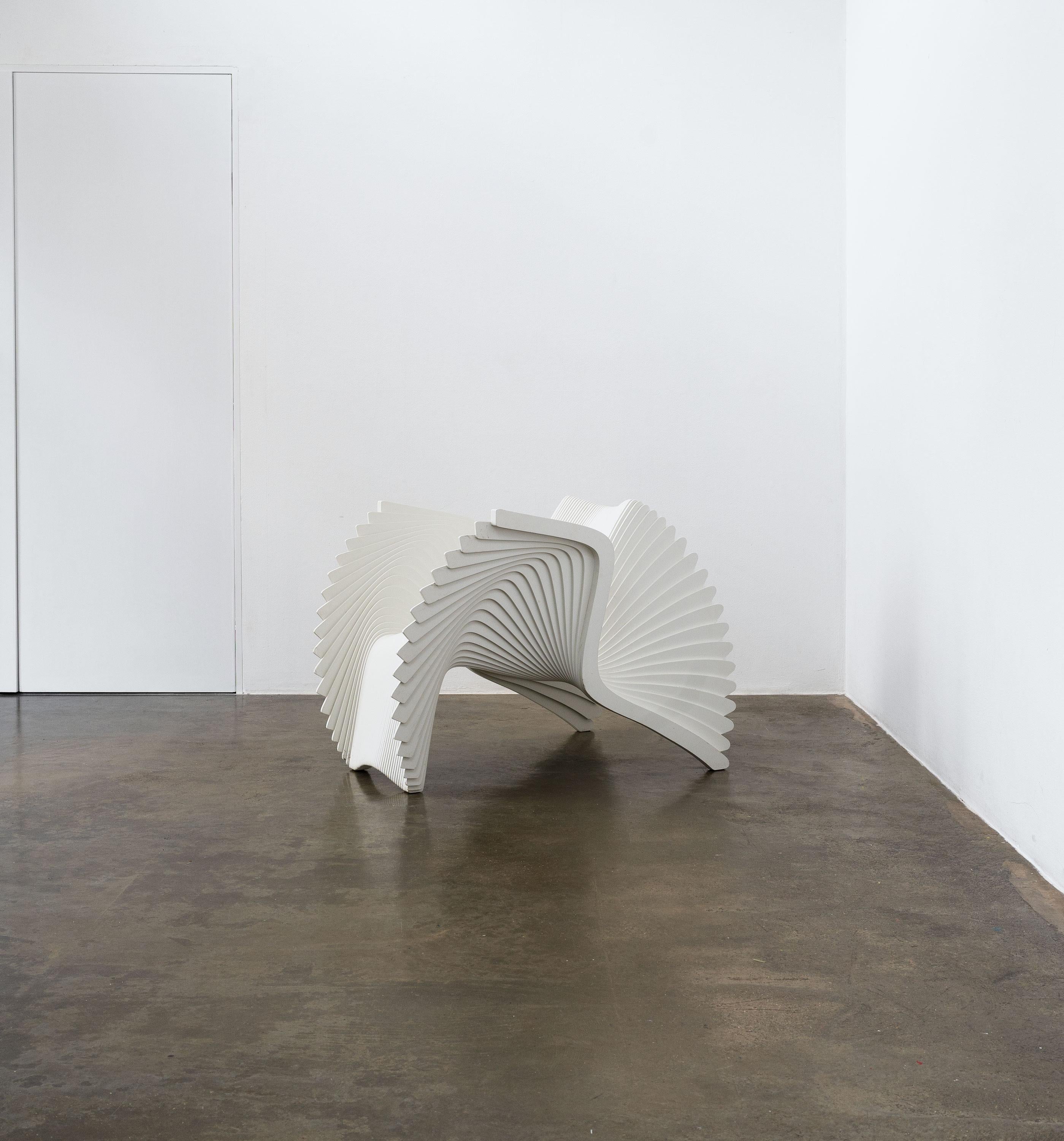 A white Monroe Chair designed by the award winning British designer Alexander White.

The Monroe Chair is an exploration of form and function through repetition using modern technologies to replicate endless identical items, a task impossible by