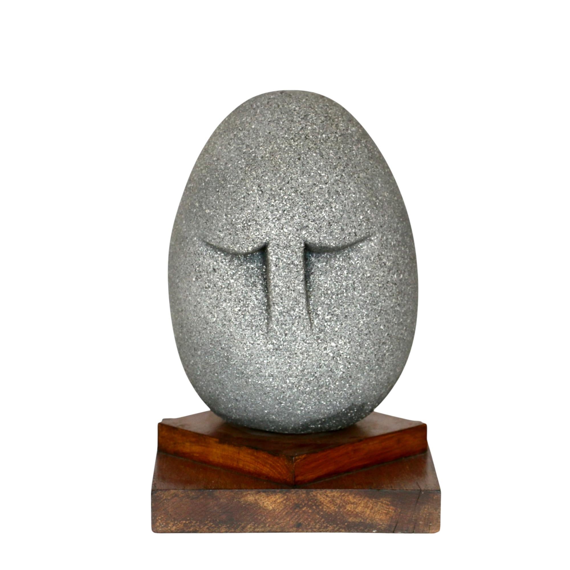 A head placed on a double oak wood base. Anonymous. France, 60s.