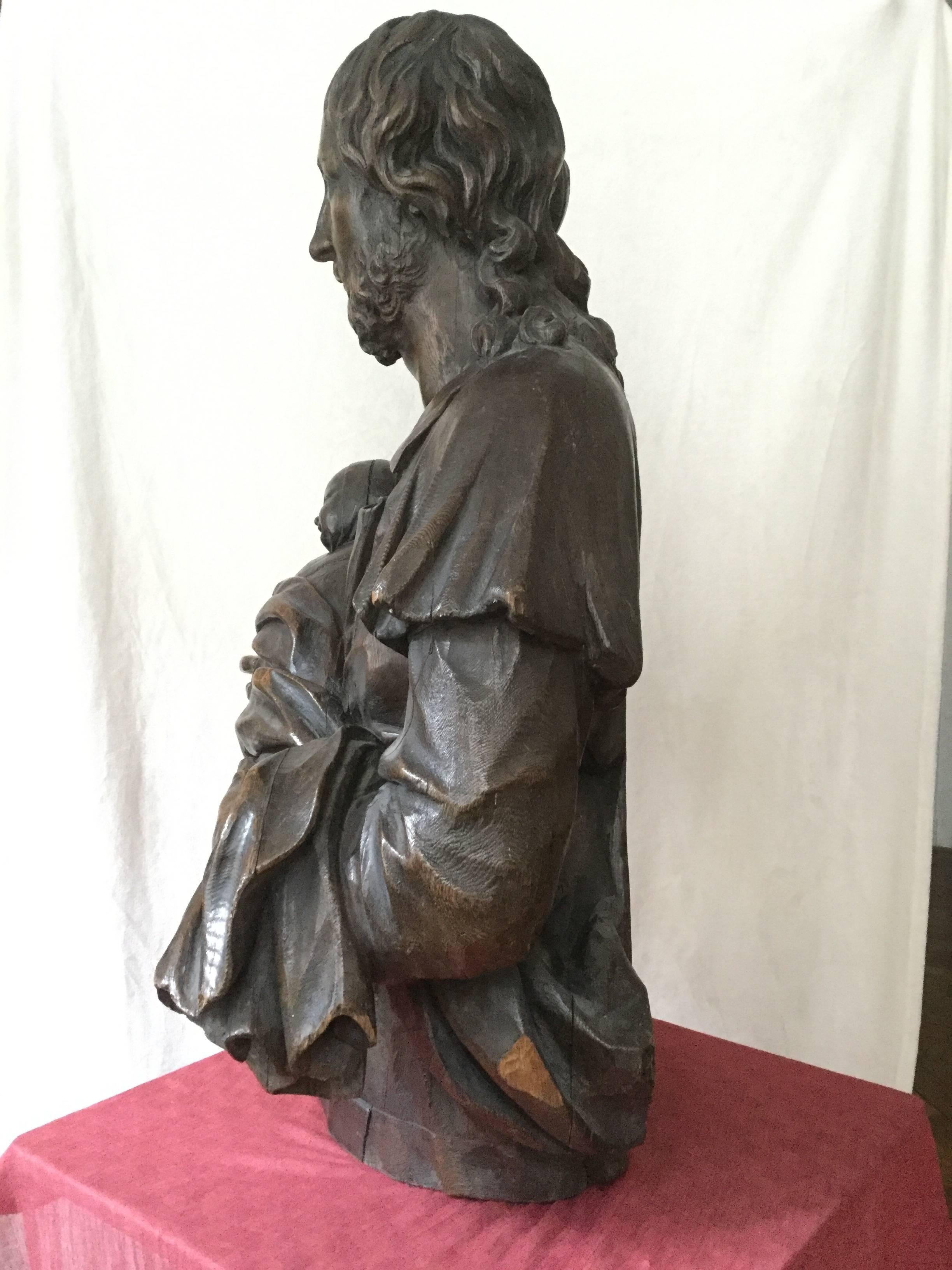  A sculpture representing an Oak bust of  the Christ holding a child swaddled in arms. Austrian School 18th century 
One may think that there is the image of Christ letting the little children come to him; Gospel of Matthew, 19:14
This kind of