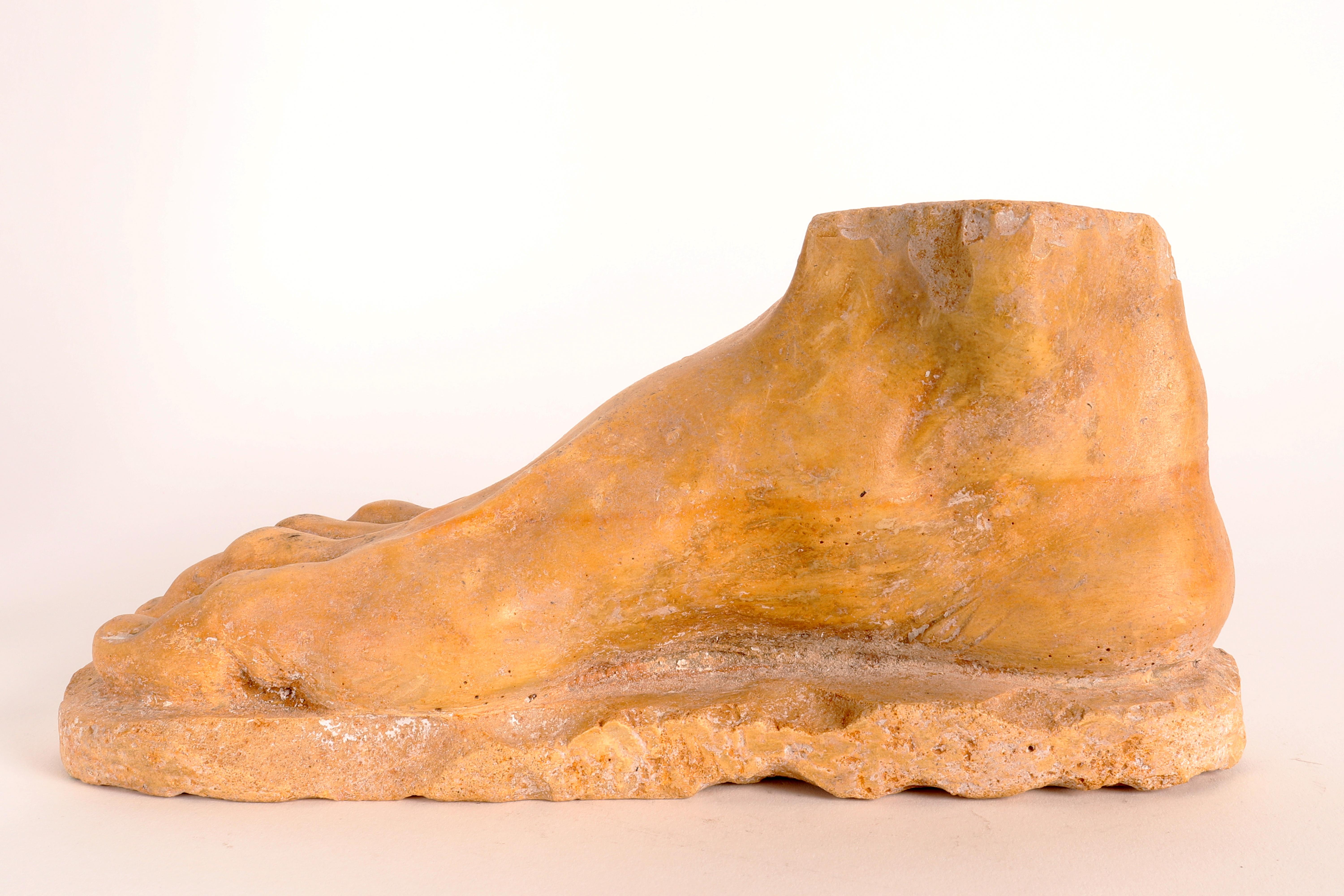 Sculpture of a foot in yellow Siena marble. The sculpture rests on a hinted ground. Replica of a classic type, the construction is excellent, from the proportions to the minimum attention to detail, such as the anatomy detectable under the skin. The