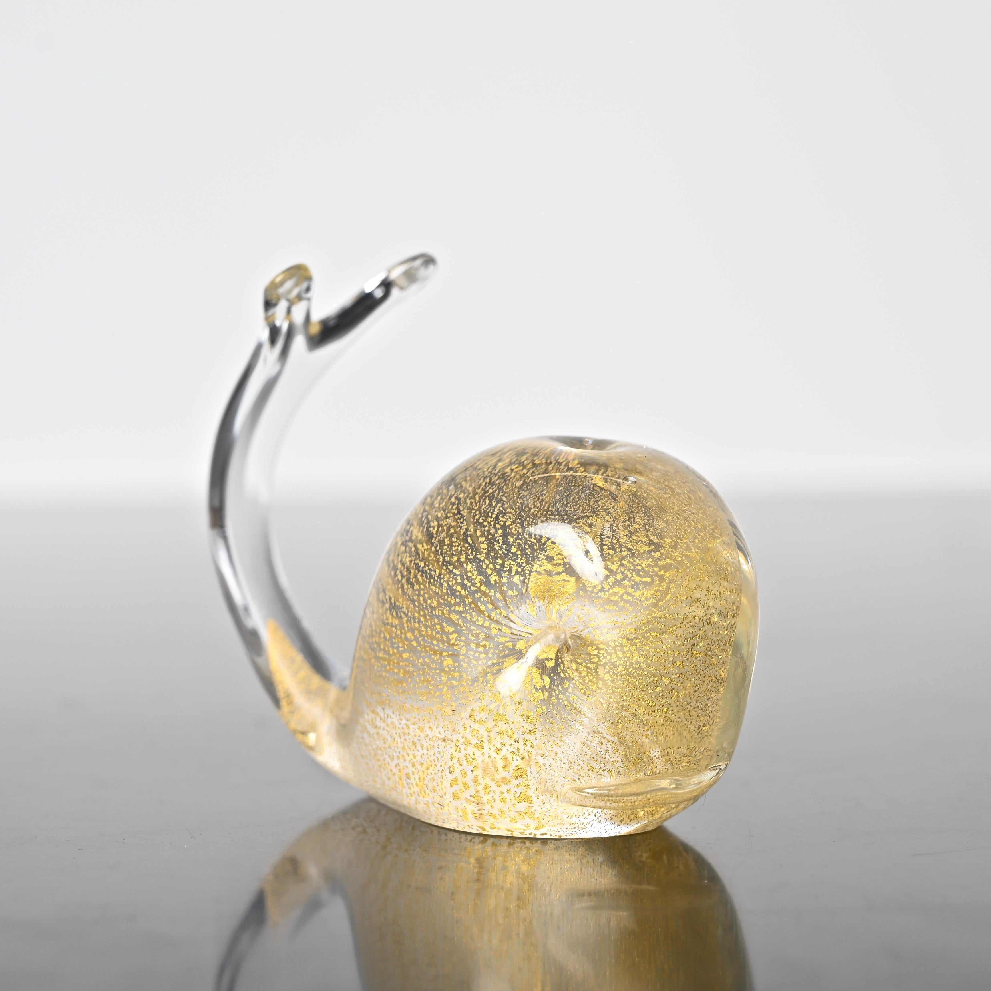 Fantastic whale-shaped Murano mouth-blown glass sculpture with gold dust inside designed by Archimede Seguso in Italy during the 1960s. shaped paperweight made mouth-blown Murano glass with gold leaf inside. This incredibly charming paperweight was