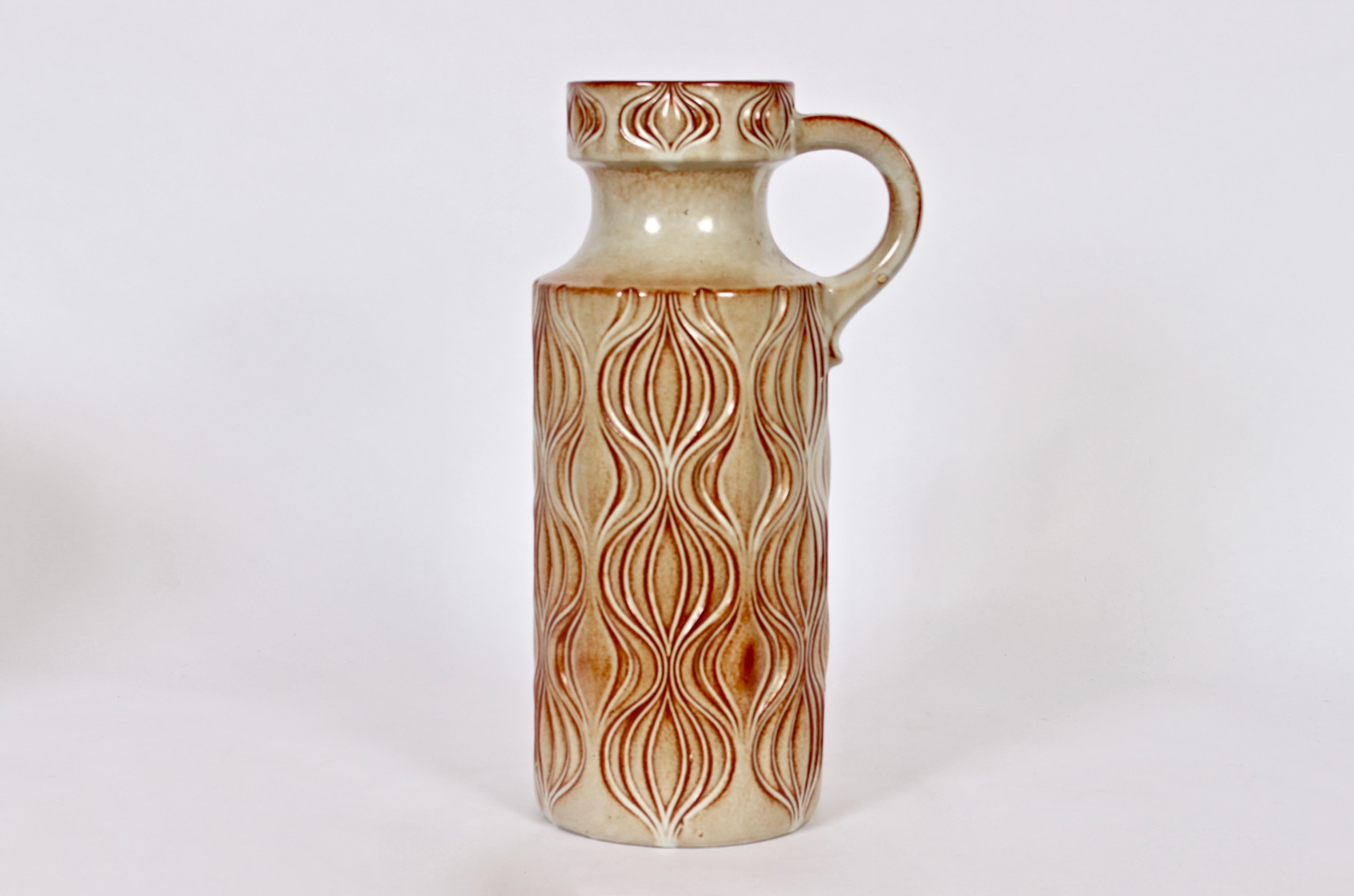 Schedurich handcrafted Amsterdam decor floor vase with handle. Bottle form Natural. Featuring a geometric relief, Beige background and Maroon highlights. Ceramic 7D without handle. Signed W. Germany.