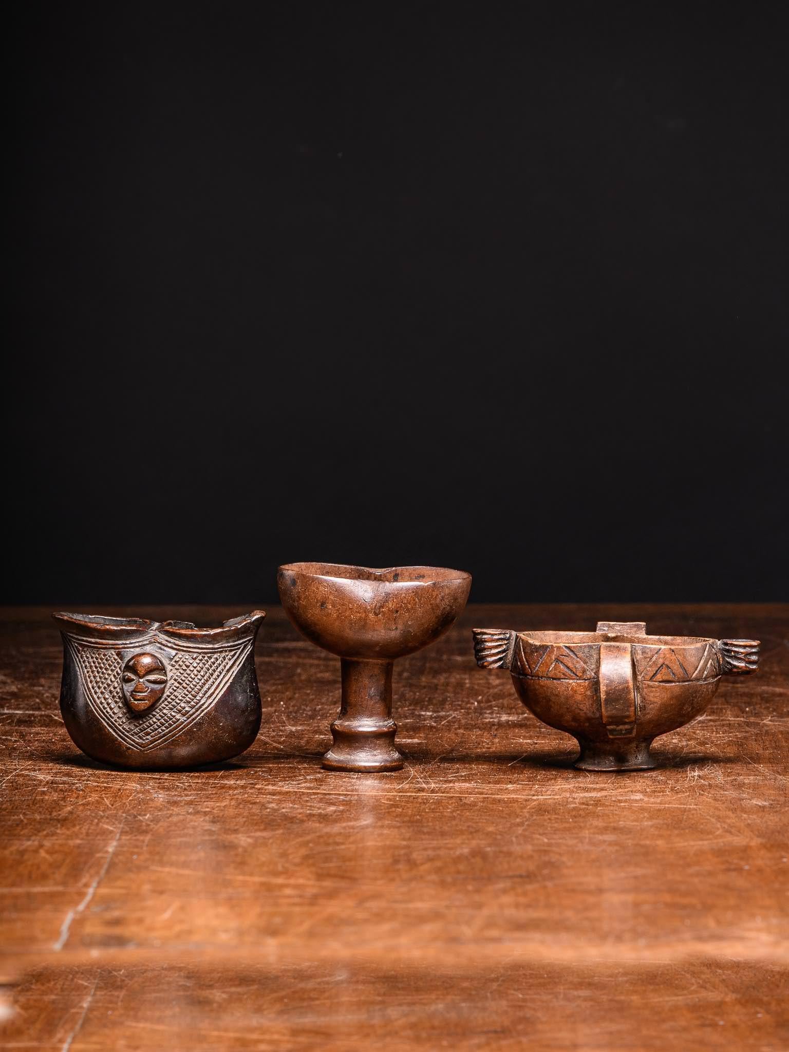 Yaka community leaders have a number of items that form part of their royal collection. One of these items is the kopa ceremonial cup (also called koopa or mbassa; used by the Suku too)carved from one piece of wood with two leaf shaped apertures,