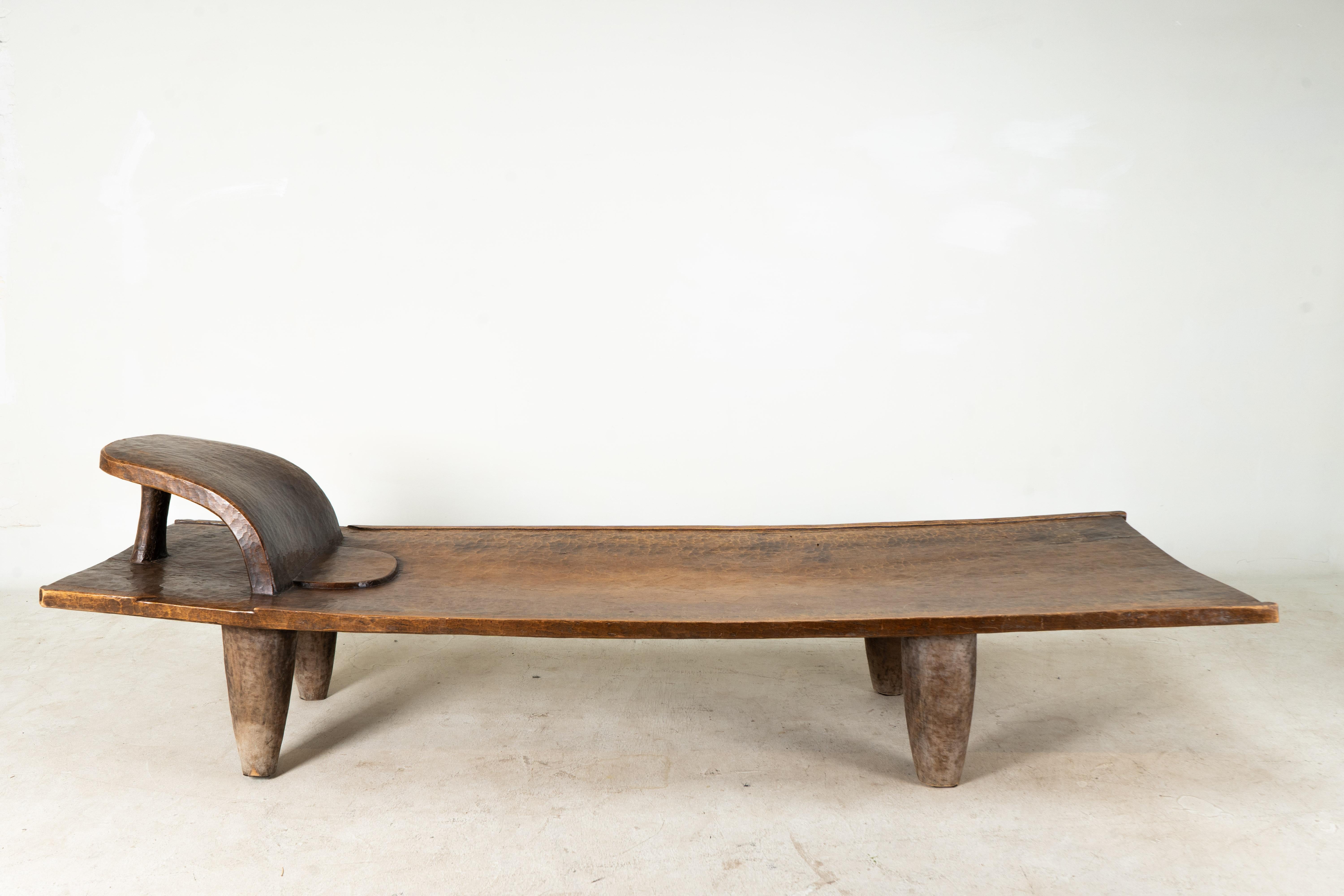 This large carved and chiseled bed was carved from a single piece of iroko wood in the Ivory Coast. It dates to the early 20th Century.

Abstract and sculptural, the wooden forms of the Senufo people of West Africa are imbued with a unique