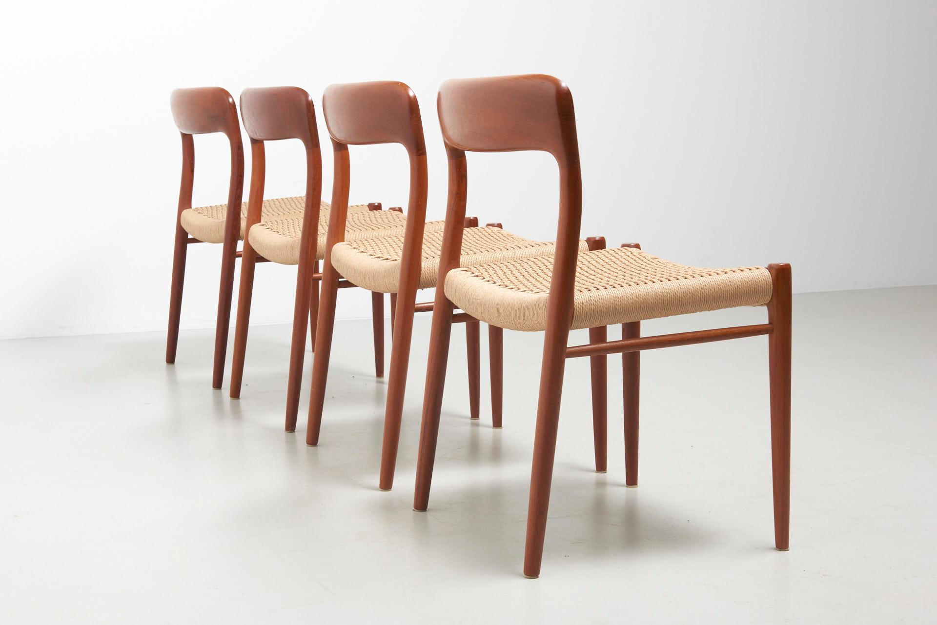 Set of 4 dining chairs in teak with carved backrests. Model 75, designed by Niels O. Møller in 1954. Made by J.L. Møllers Møbelfabrik in Denmark. The chairs have new papercord seats.