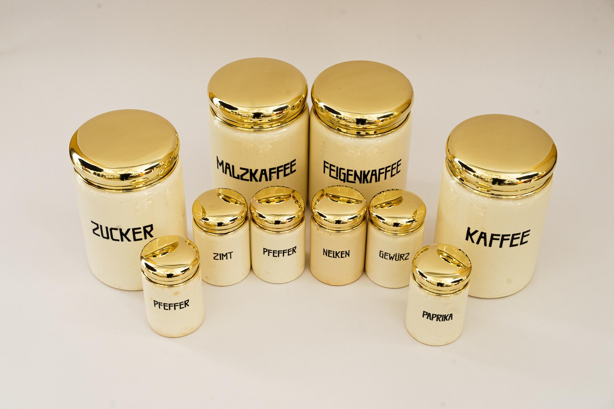A set of 10 ceramic spice jars vienna around 1930s

4 big one 
H: 15cm 
Diameter: 10cm

6 smaller one 
H: 9cm 
Diameter: 5cm

Brass polished and stove enameled
1 has a little damage see last picture