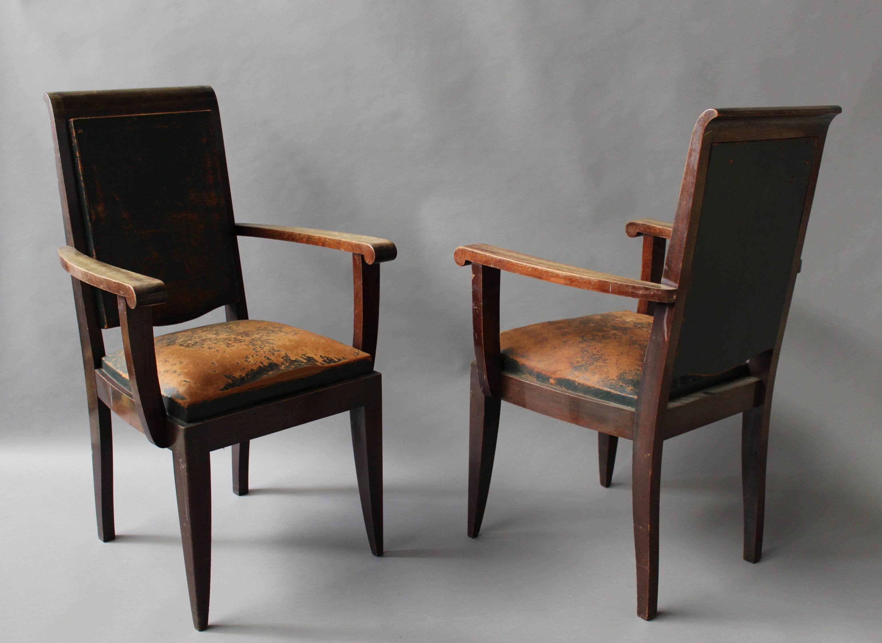 A set of 10 fine French Art Deco solid mahogany dining chairs by Gaston Poisson (8 side and 2 arm).
Dimension of the arm chairs are H 38 1/8