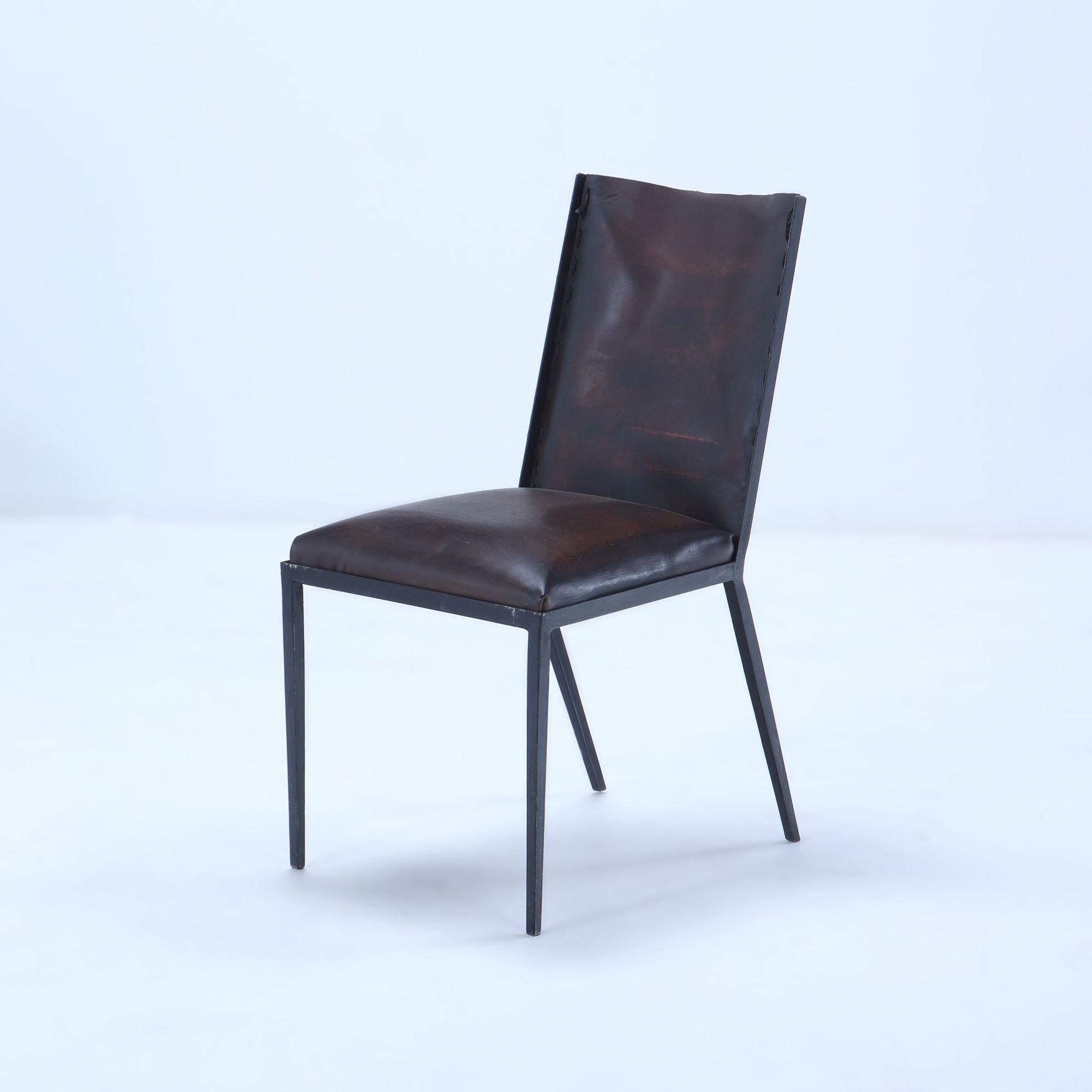 A set of 10 iron and leather dining chairs, in the manner of J.M Frank, contemporary.