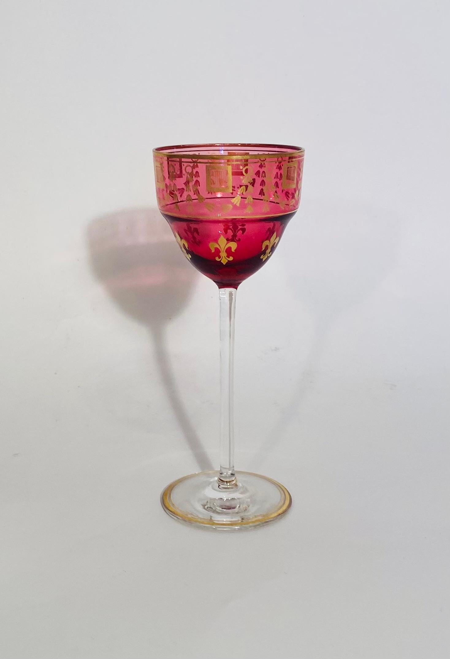 A vibrant set of ruby red and interesting gilt wine goblets featuring a fleur de lis design. Nice and tall and in very good antique condition. We attribute to one of the finer French crystalleries of Baccarat or Saint Louis. 