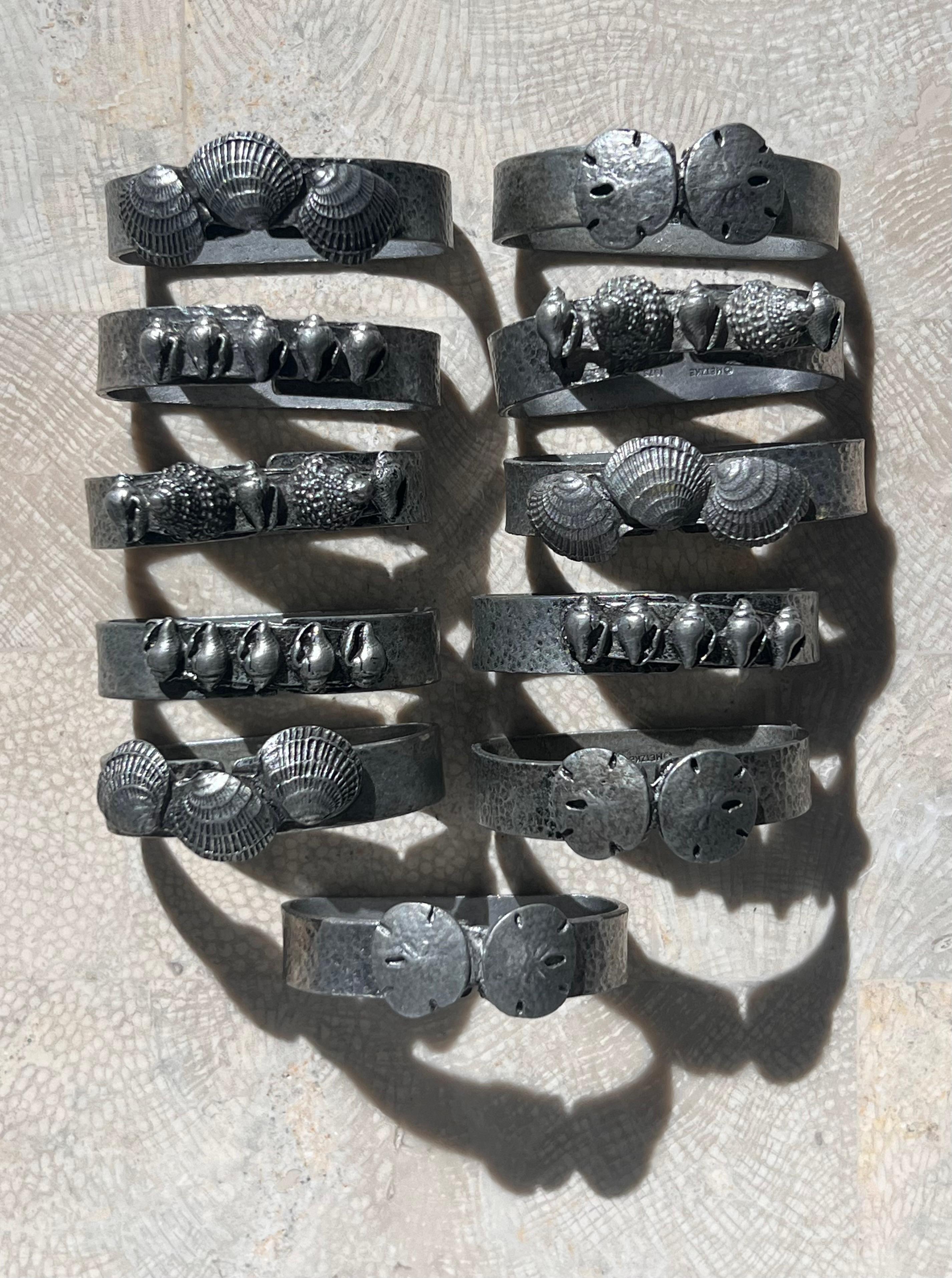 North American A set of 11 pewter napkin rings with sculpted shells, 1975 For Sale