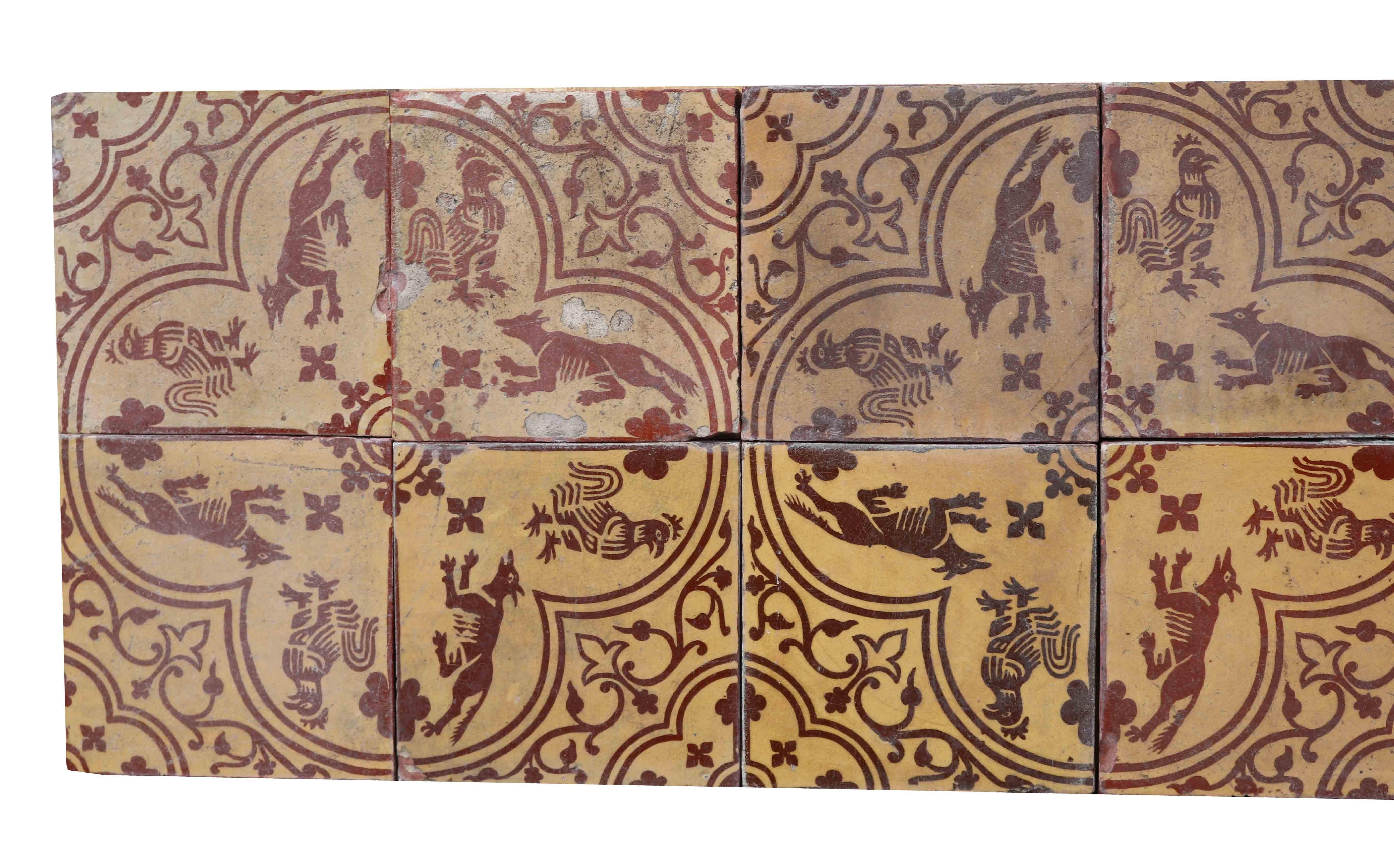 Twelve encaustic tiles (three, four tile panels) with a neo-medieval design.

Four tiles combine to form a quatrefoil with a fox and a hen in each foil and with quarter quatrefoils at the outer corners.
