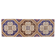A Set of 12 Used Minton & Co. Encaustic Tiles