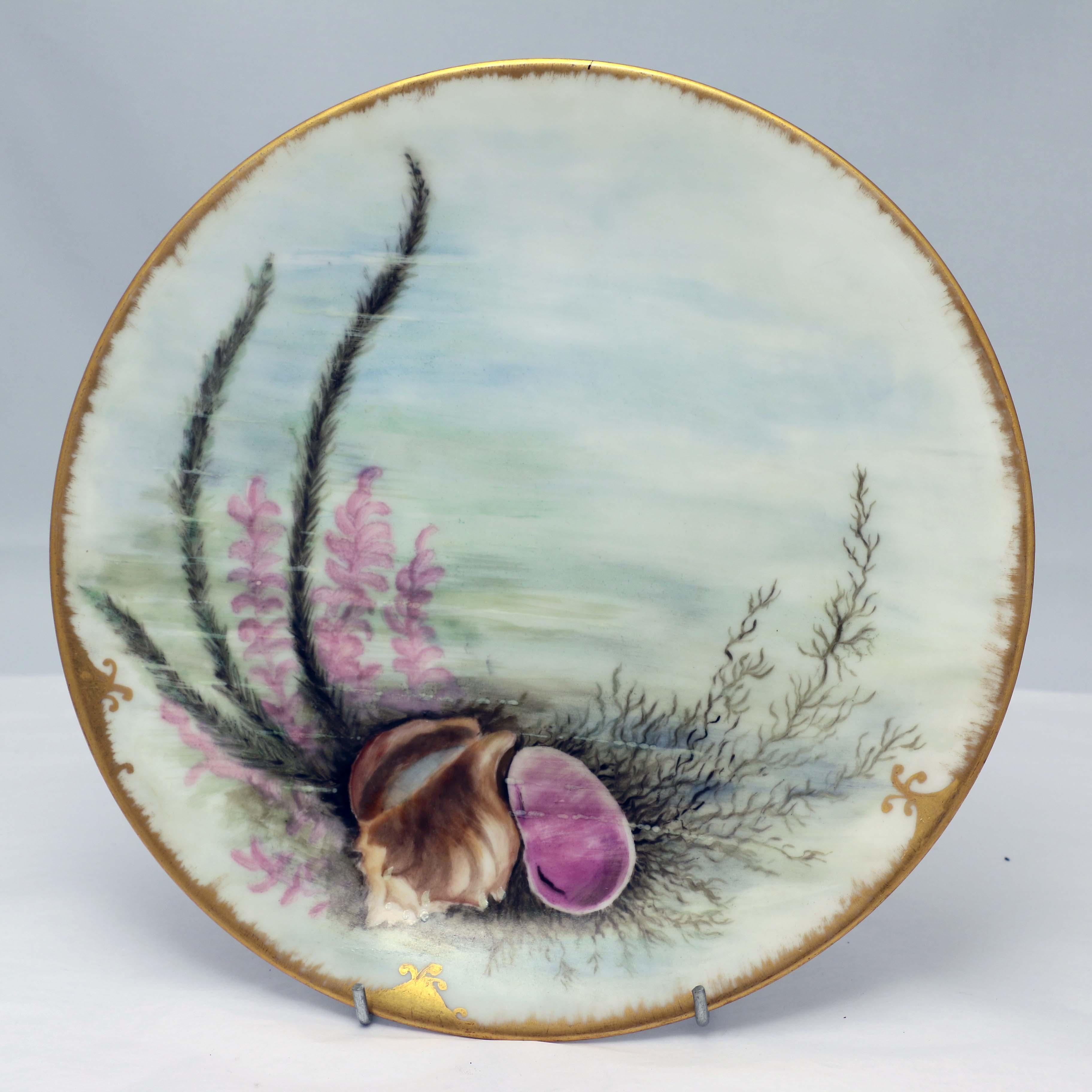 This hard-to-find set for 12 is beautifully painted, by the same hand, (8 are signed with initials). They all depict shells and aquatic plants and grasses on the ocean floor. As one would expect, they are painted in the pastel palette favored by