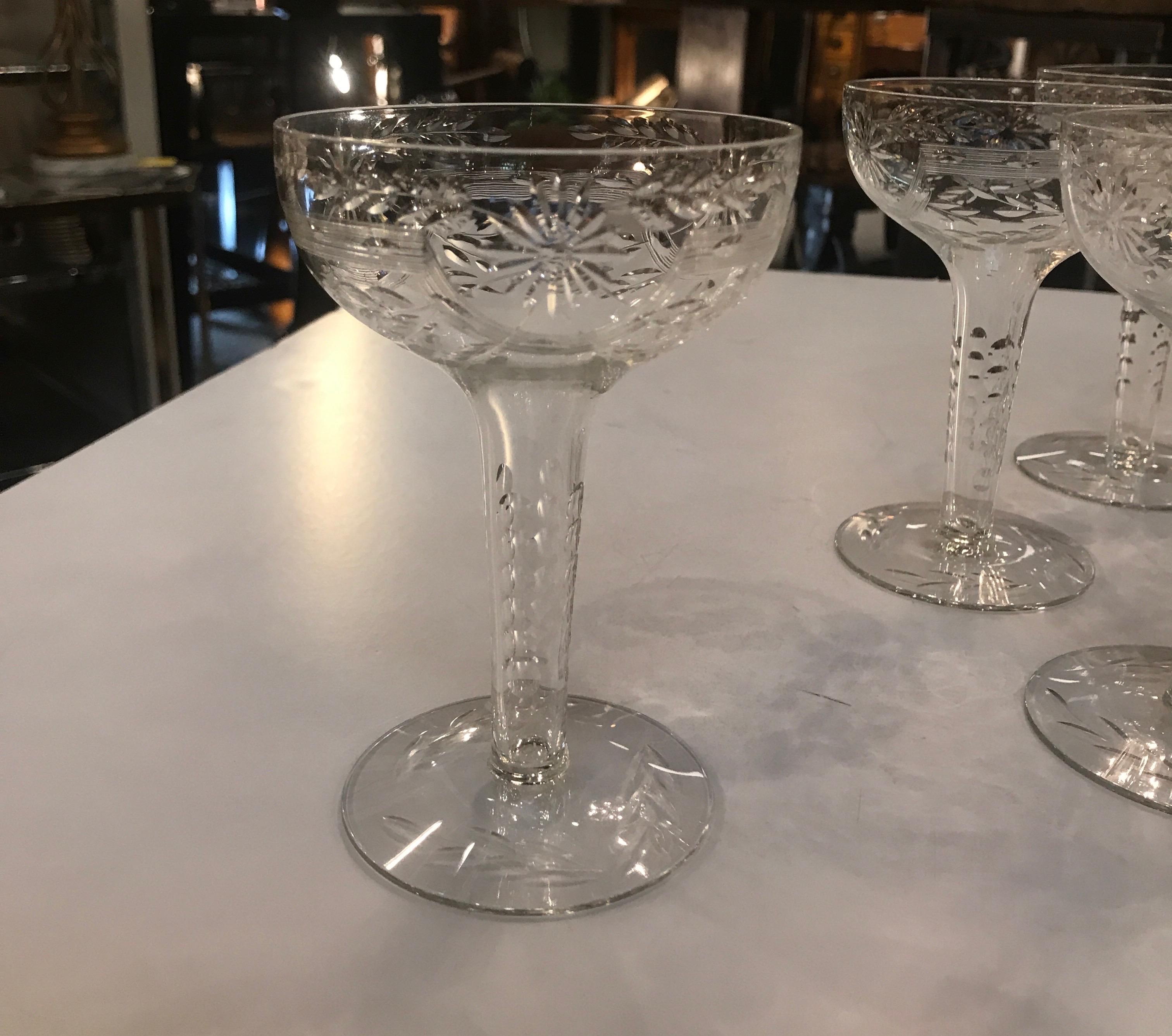 A set of 12 hand engraved champagne coupes with hollow stems, the delicate pattern on the bowls, stems and base, English, early 20th century, circa 1910. Downton Abby at its finest!