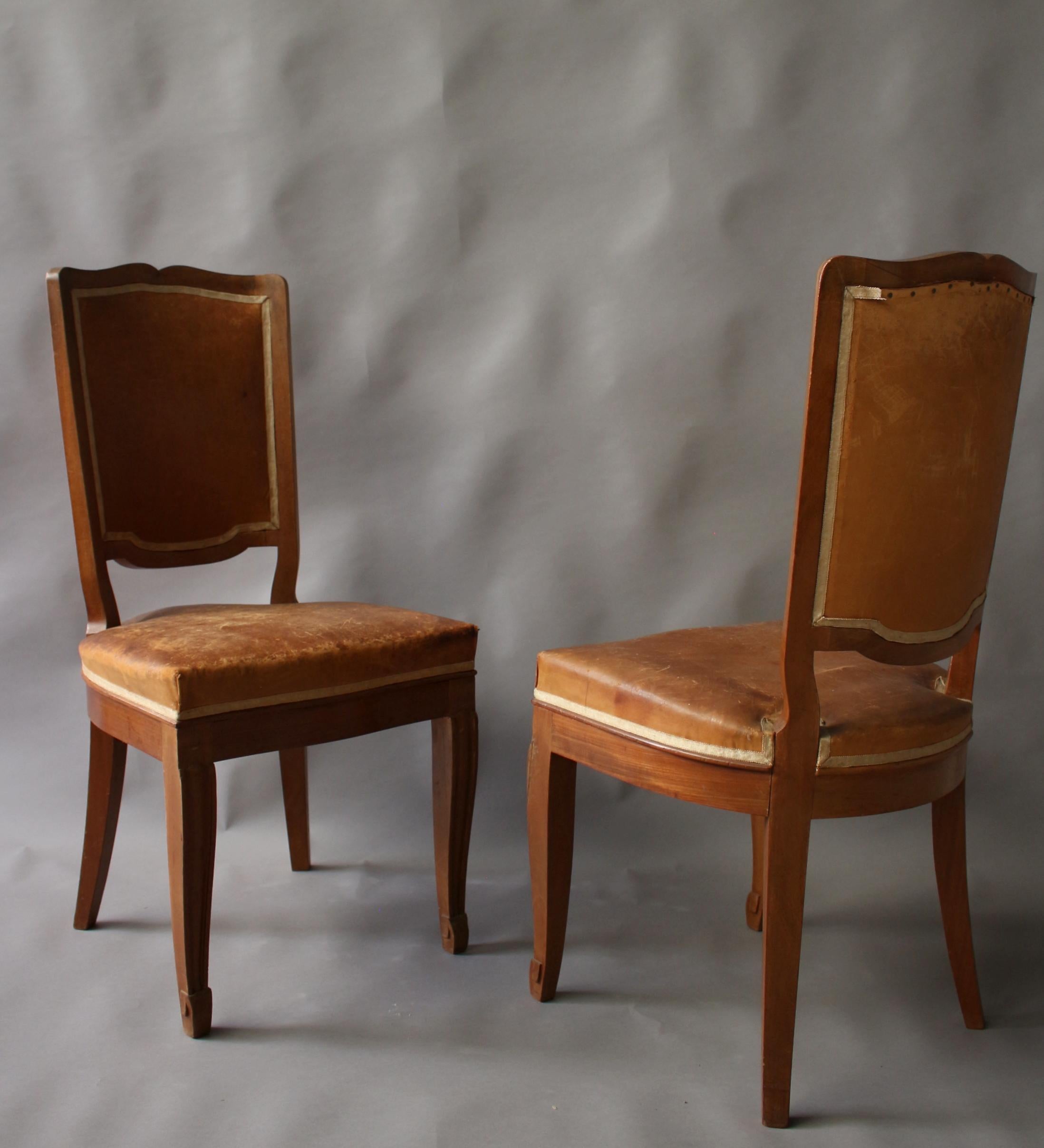 A Set of 12 Fine French Art Deco Mahogany Dining Chairs in the Manner of Arbus In Fair Condition In Long Island City, NY