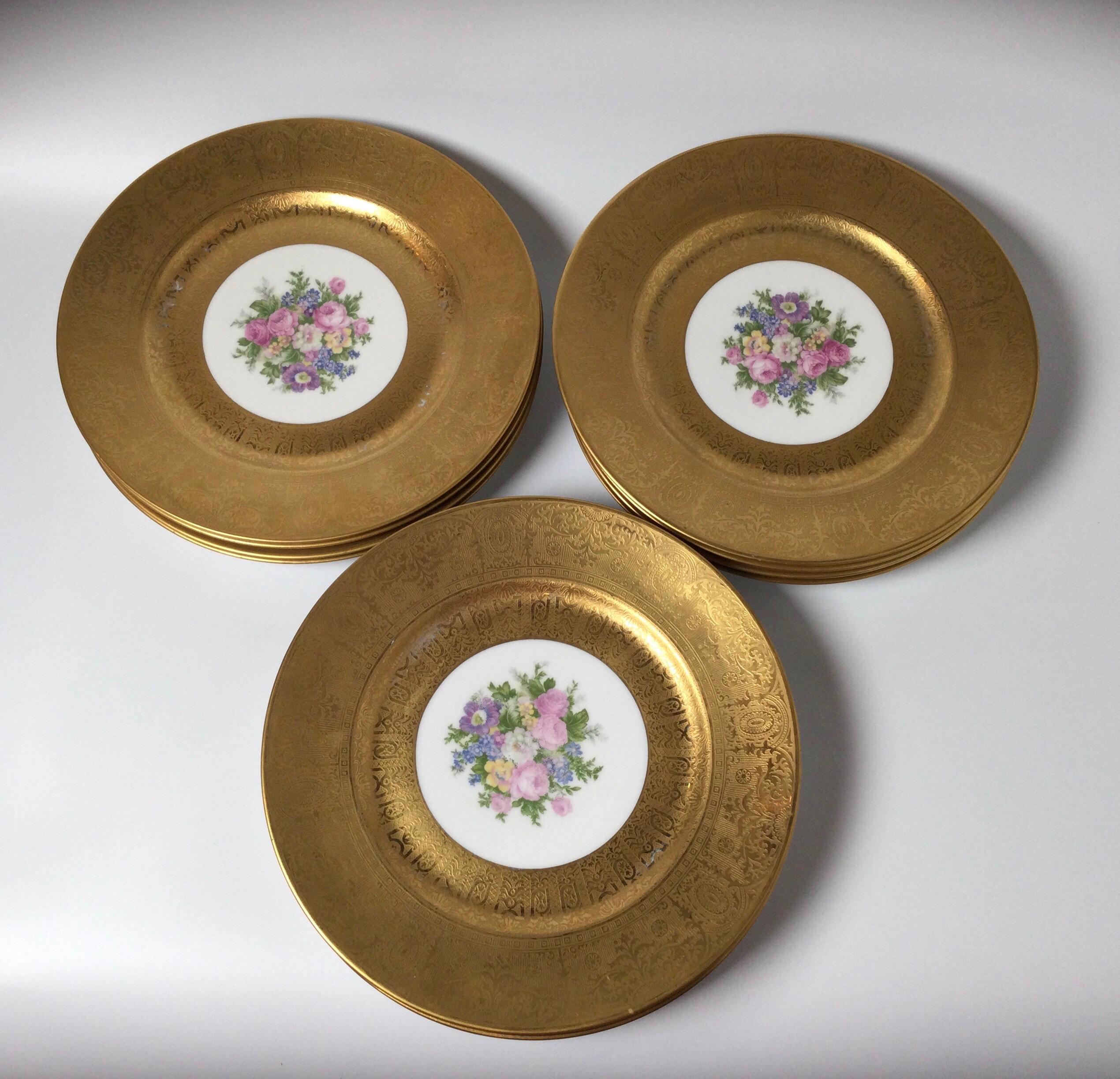 Early 20th Century Set of 12 French Porcelain Gold Encrusted Floral Service Cabinet Plates