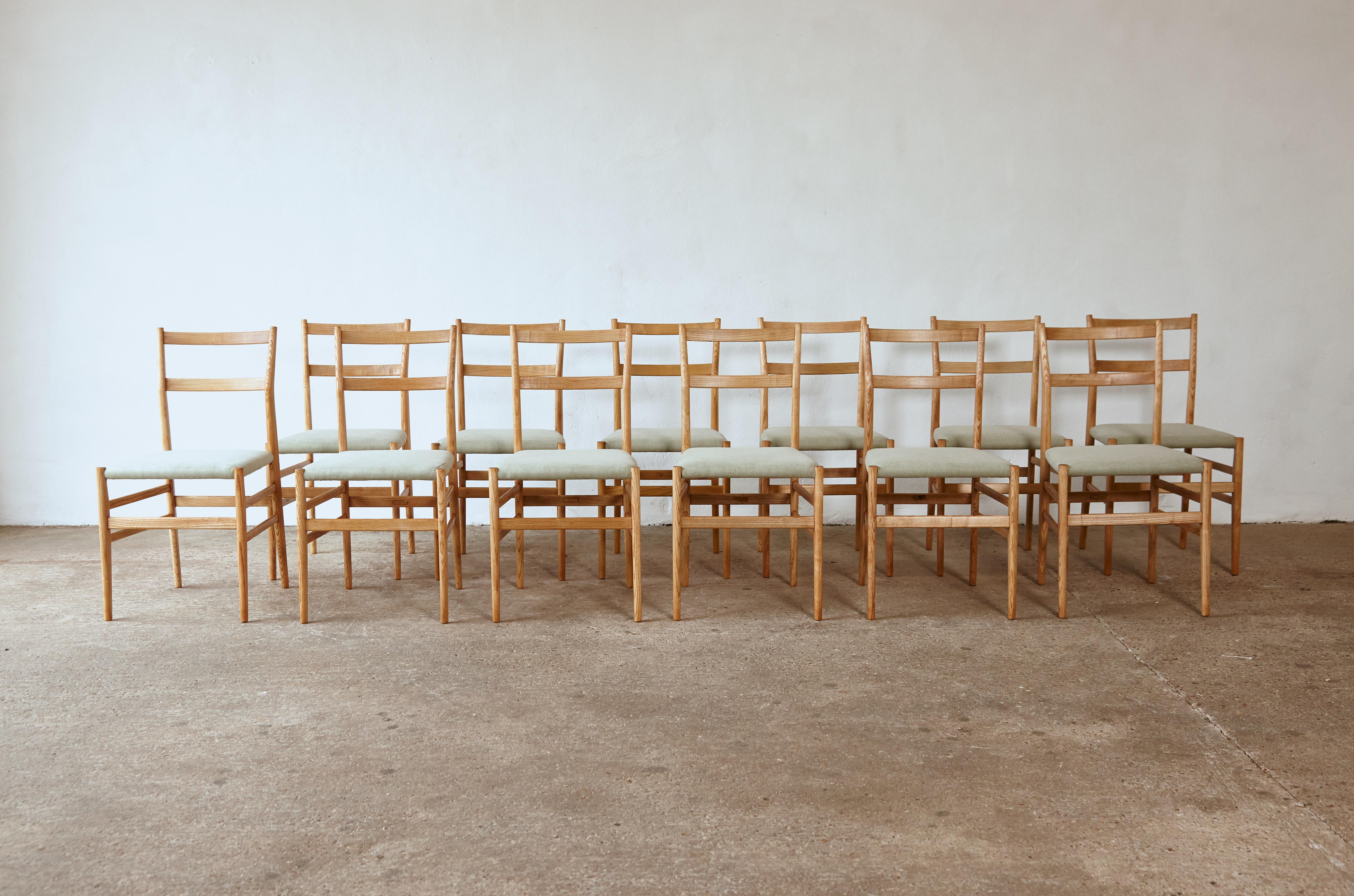 A wonderful set of twelve original, early Gio Ponti Leggera Model 646 dining chairs, Cassina, Italy, 1950s. In restored condition with new upholstery. All with maker’s label marked 'Figli di Amedeo Cassina' under each seat.   Fast shipping