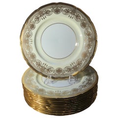 A Set of 12 Gold Encrusted Service Dinner Plates