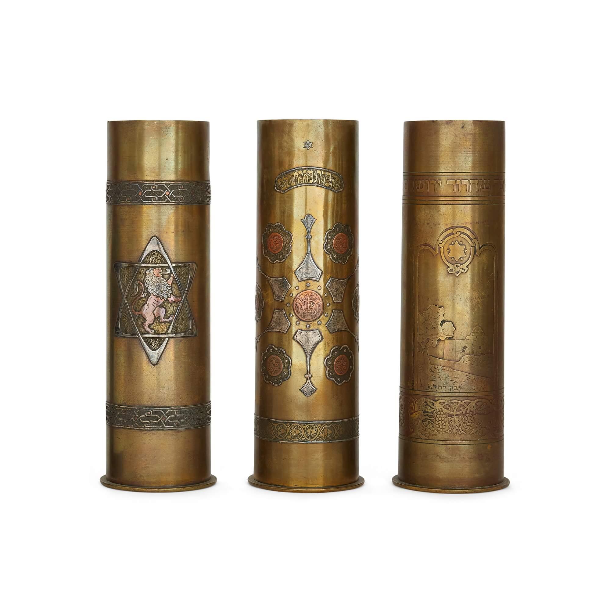 A set of 15 Bezalel Academy Judaica silver and brass decorated WWI shell cases
Jerusalem, c.1930
28cm high x 9cm in diameter

Valuable both for their religious and decorative qualities, as well as for their remarkable history, these pieces are a