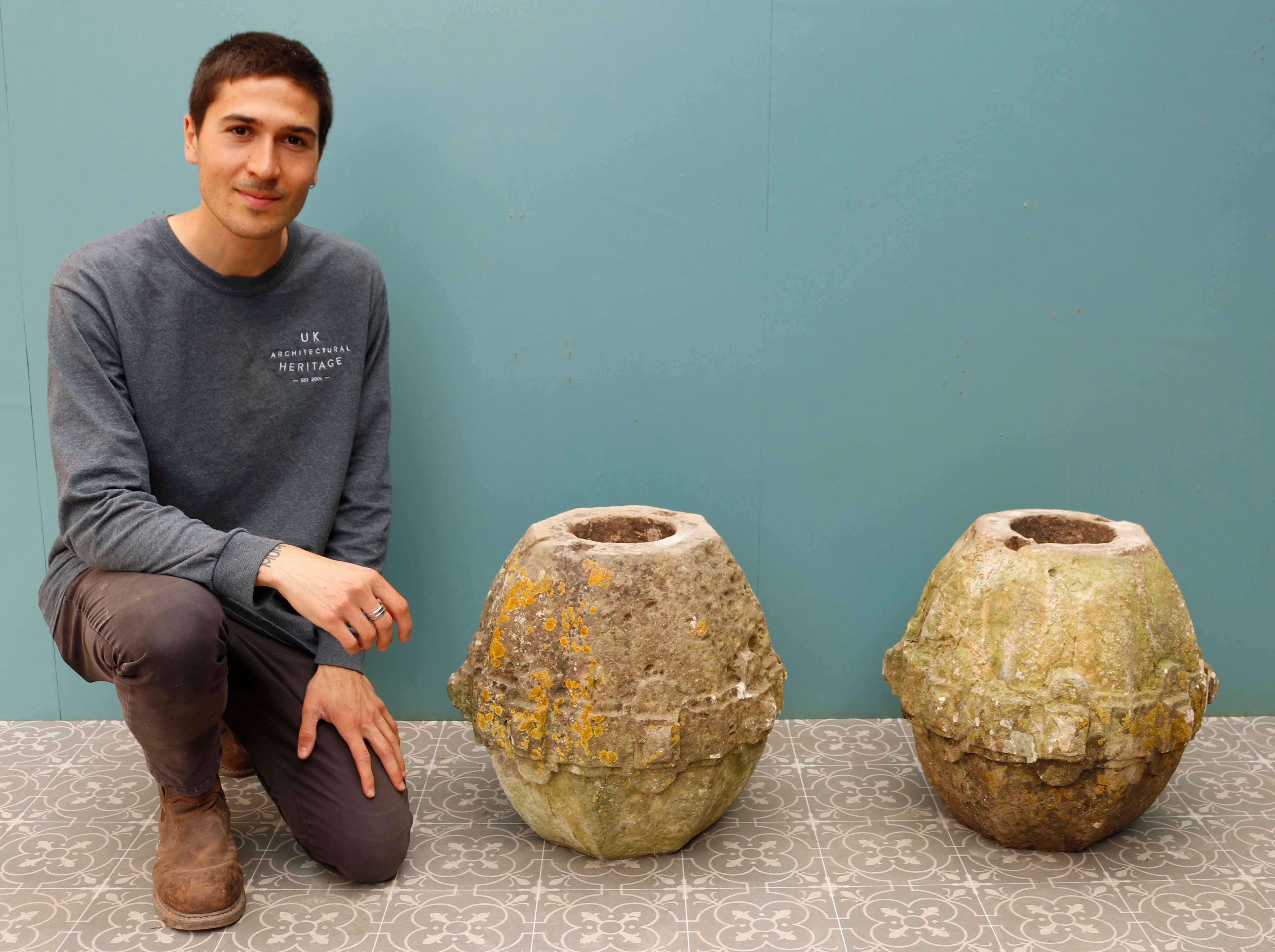 Pair of 17th Century Carved Limestone Pier Caps. Beautifully weathered, the caps are carved from a fine grade limestone with a carved belt around the middle.

They are from a property in Canterbury and could possibly have been column sections or