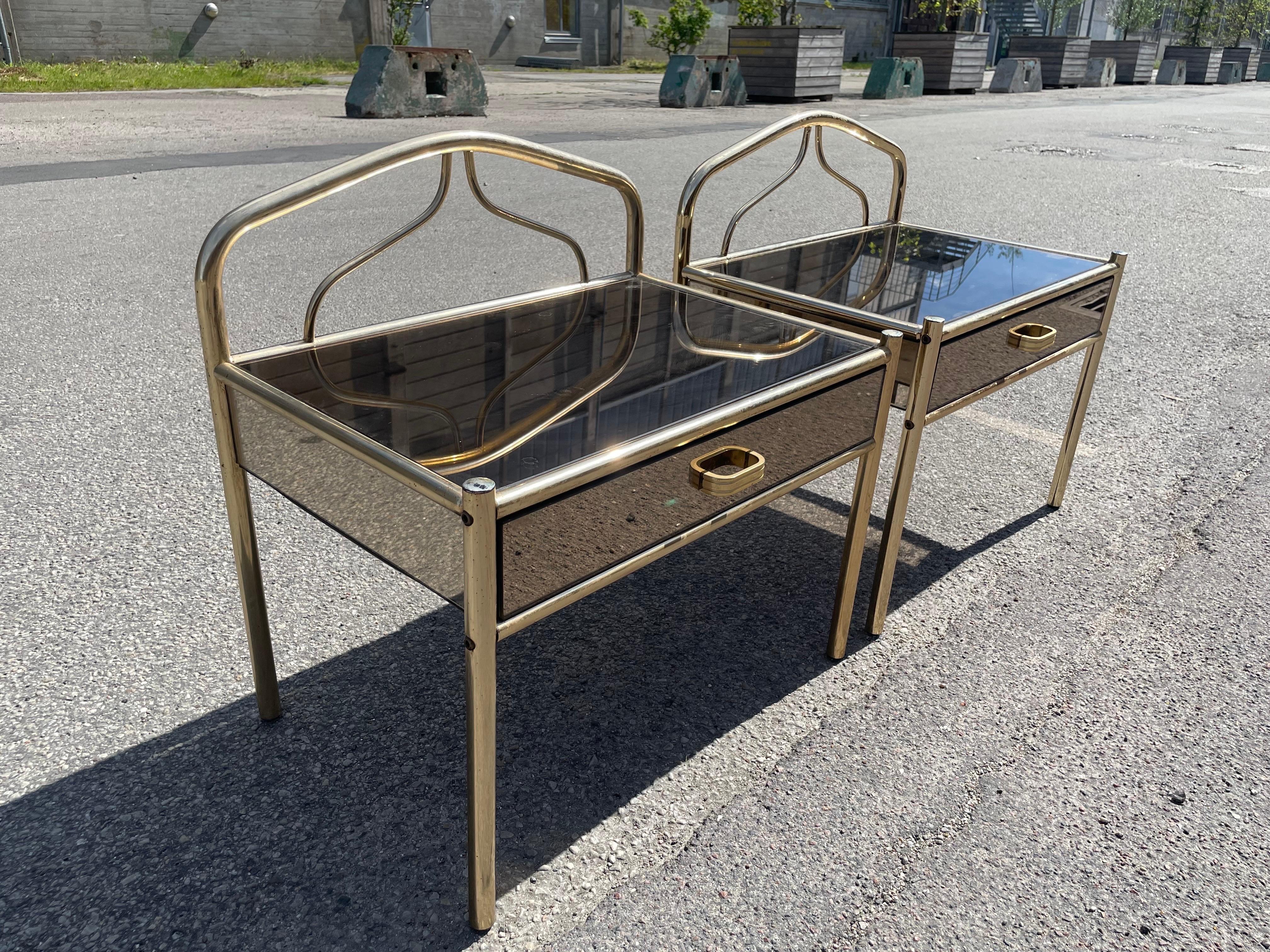 Late 20th Century A set of 1970´s brass-plated chrome nightstands with glass mirror effect For Sale