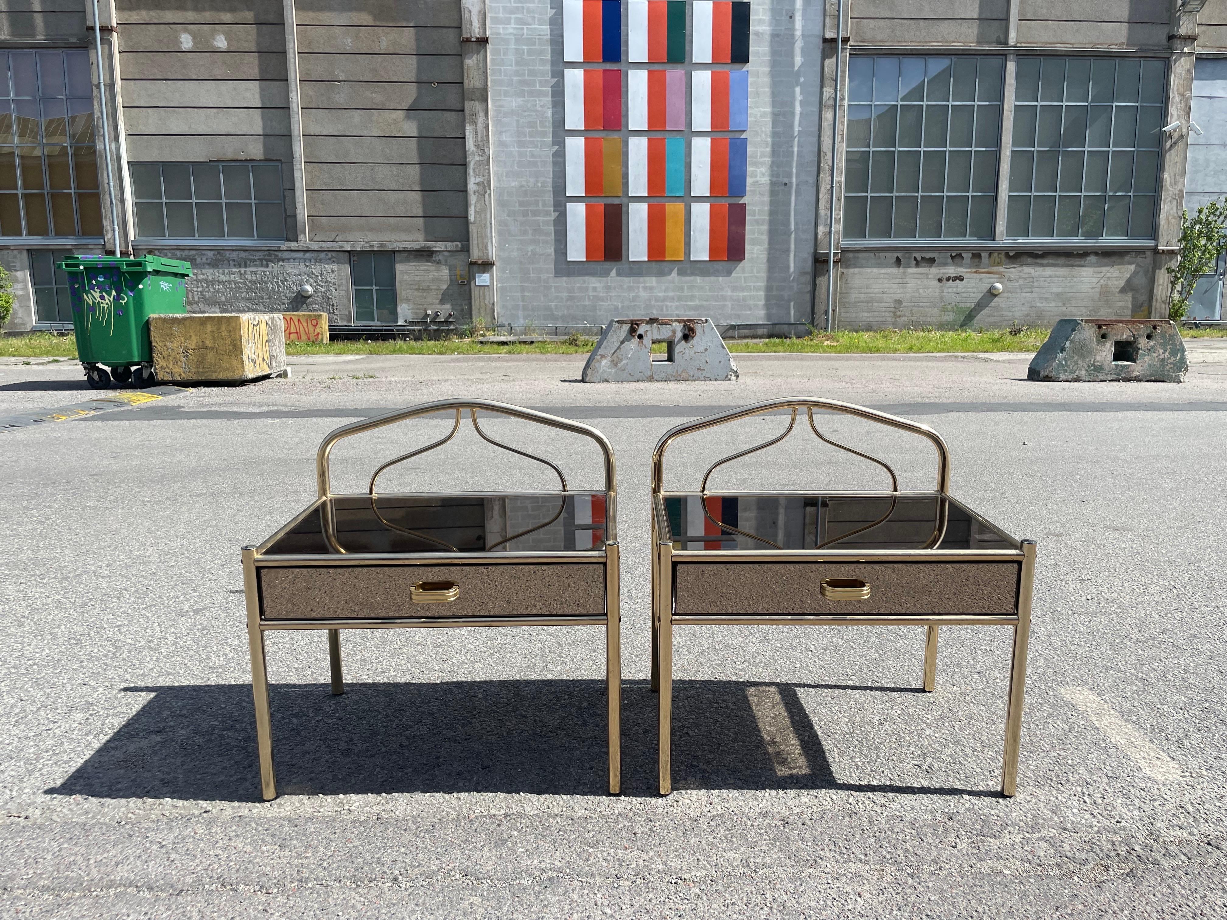Chrome A set of 1970´s brass-plated chrome nightstands with glass mirror effect For Sale
