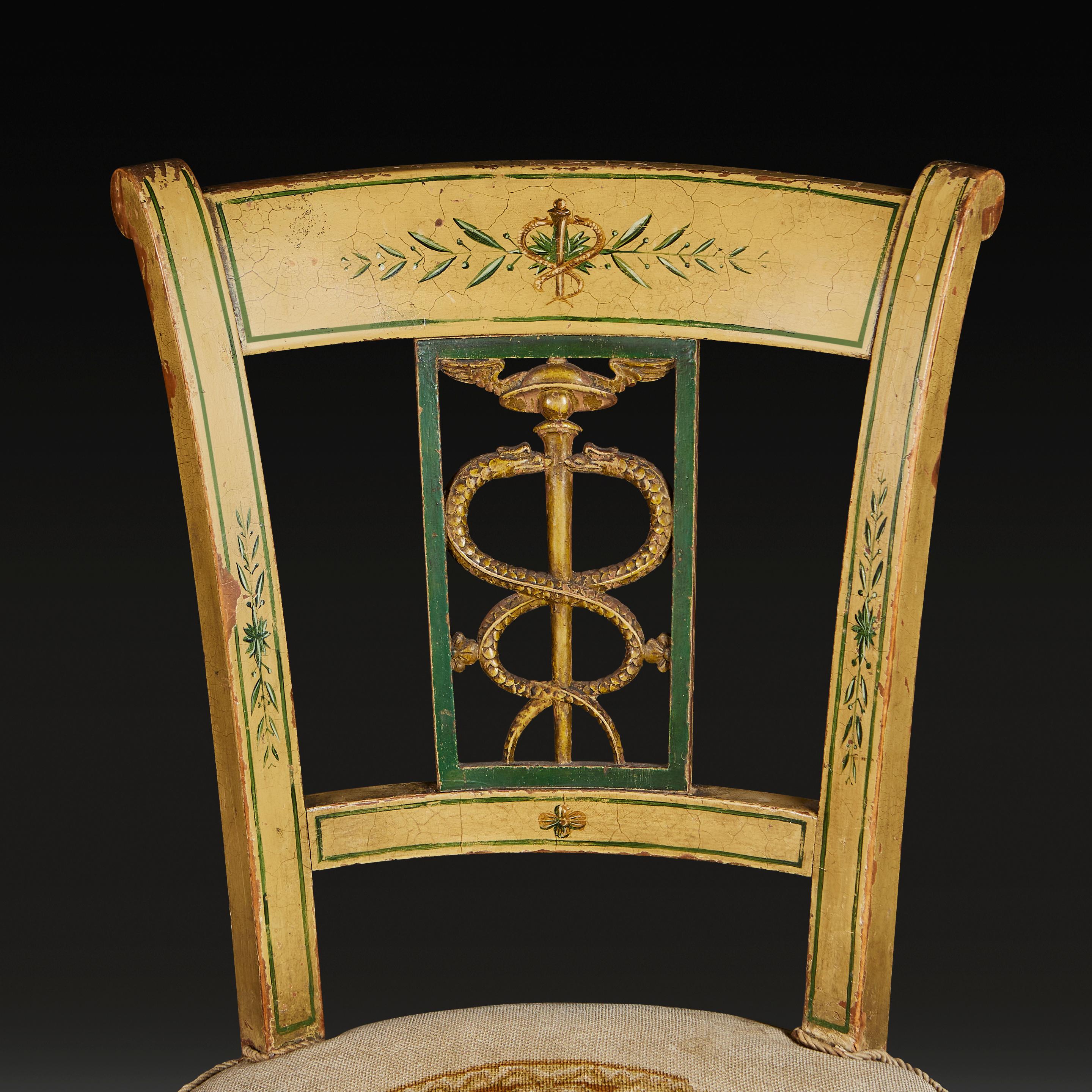 A set of four early nineteenth century North Italian chairs, the surfaces with pale yellow and green paintwork throughout, with carved and pierced serpentine back splats, with needlework seats.

Height    88.00cm

Width      59.00cm

Depth    