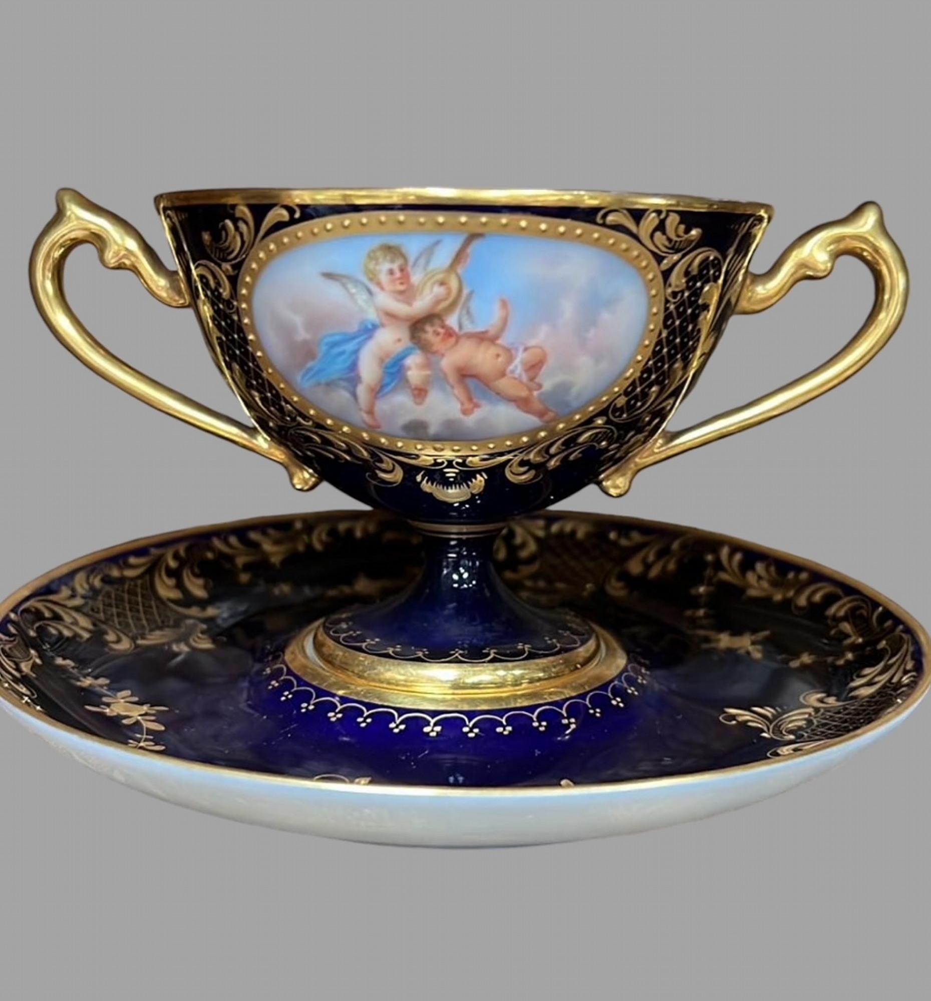 A set of 19thc Dresden Porcelain Double Handled Cup and Saucers 4