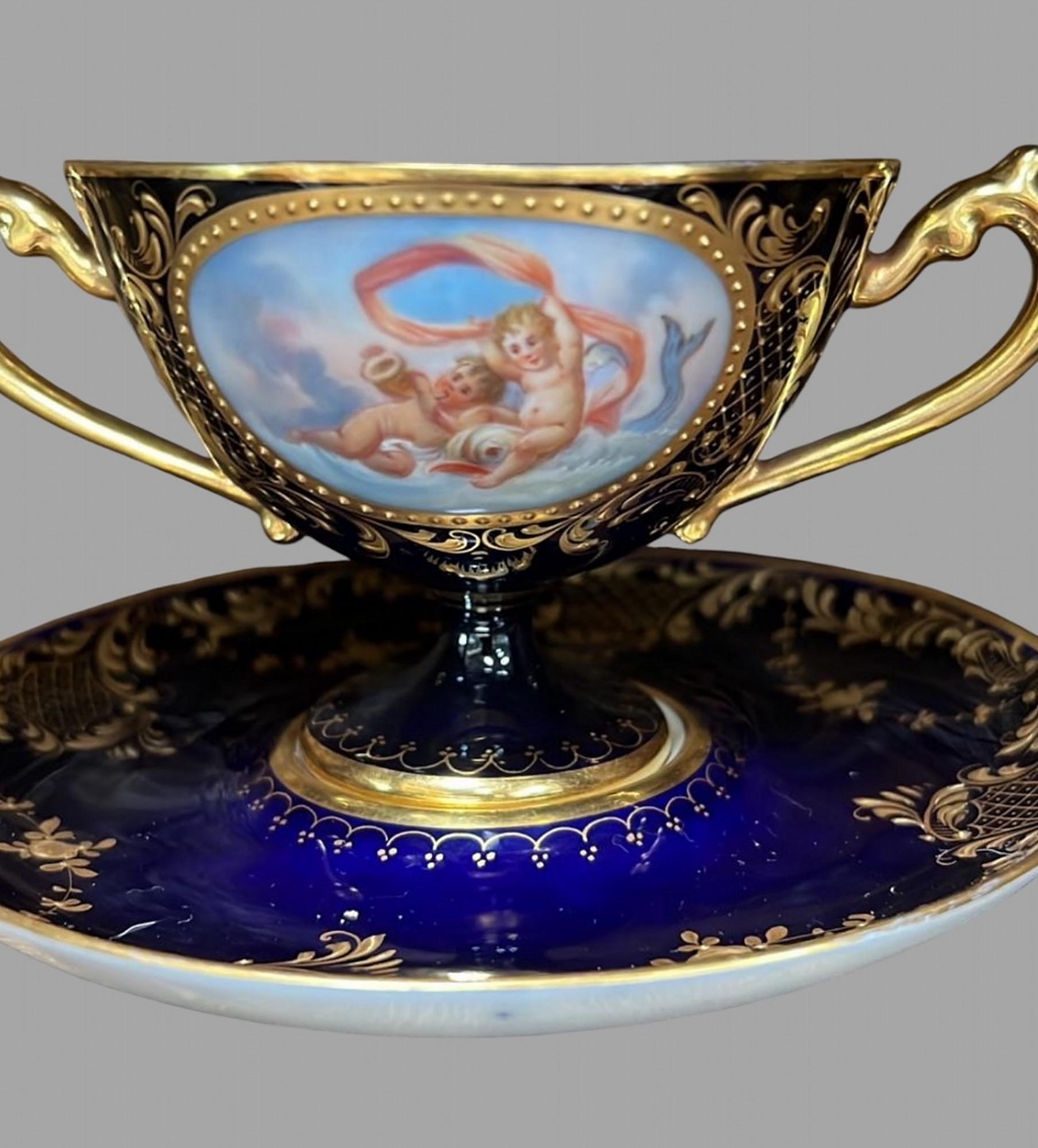 A set of 19thc Dresden Porcelain Double Handled Cup and Saucers 7