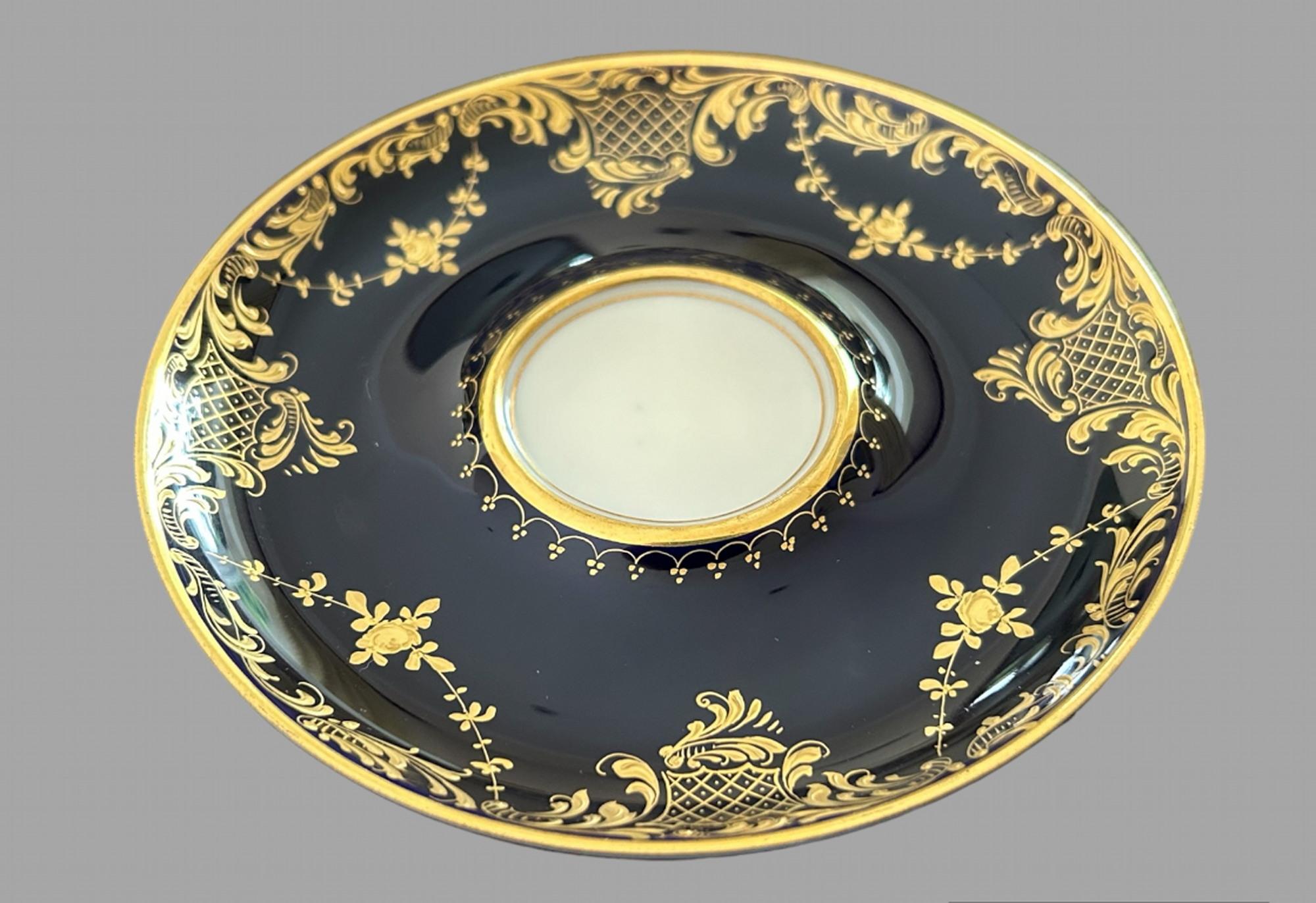 German A set of 19thc Dresden Porcelain Double Handled Cup and Saucers