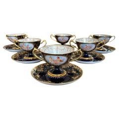 A set of 19thc Dresden Porcelain Double Handled Cup and Saucers
