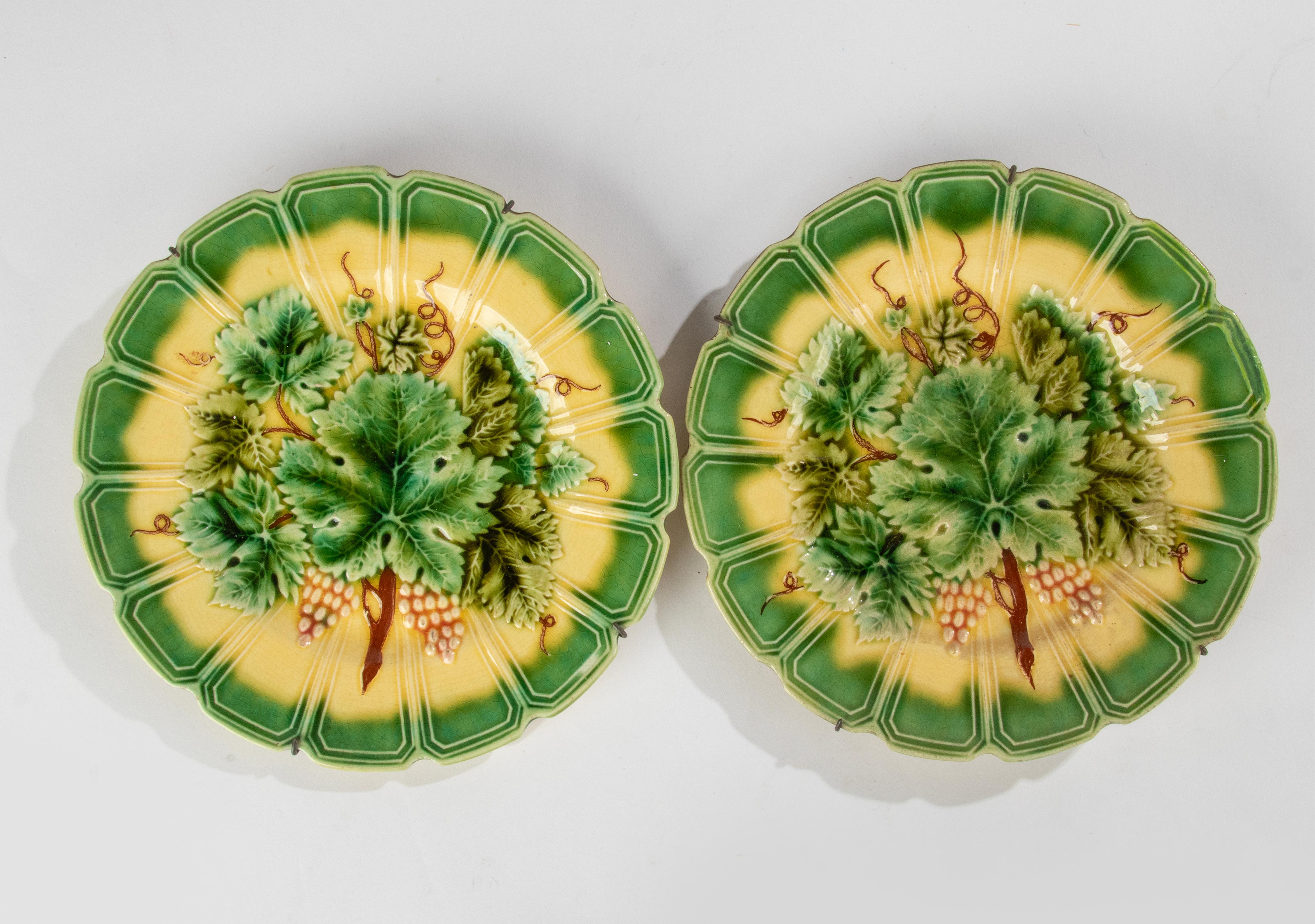 A lovely set of 2 antique majolica plates, made by the French brand Sarreguemines. 
This plates are both marked with blind marks on the back. 
