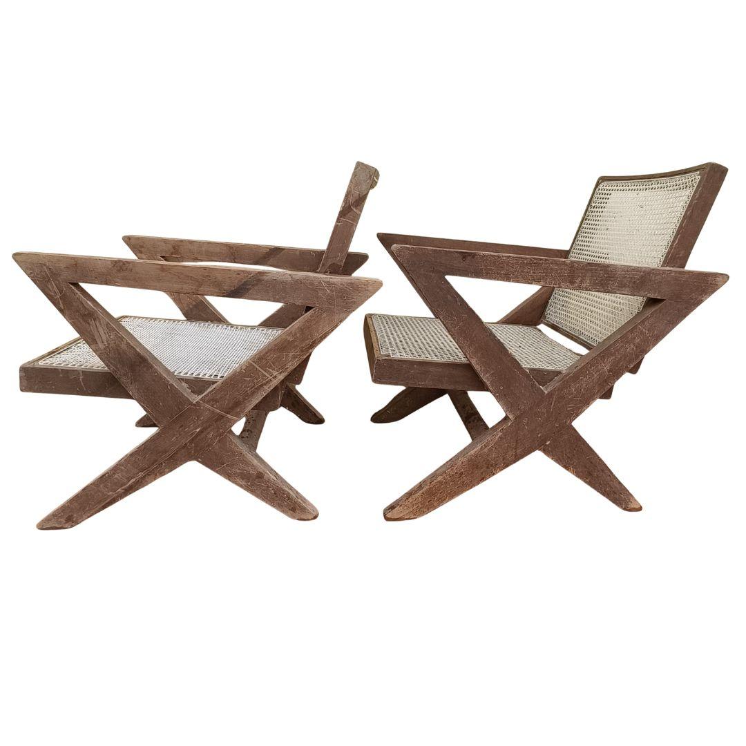Crafted in solid Indian teak, the PJ-SI-45-A lounge chairs designed by Pierre Jeanneret  feature the iconic X-leg structure — a hallmark of Jeanneret’s Chandigarh designs. The wood is in very good structural condition and retains its original