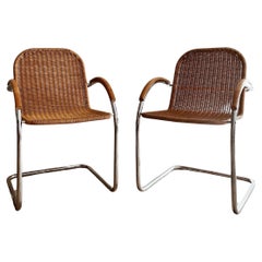 A set of 2 danish cantiliver rattan chairs Vintage A set of 2 danish cantiliver rattan chairs
