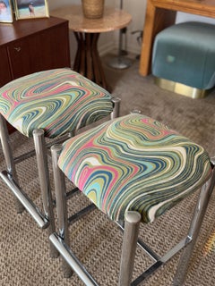 A set of 2 sleek Cal-Style chrome stools reupholstered in a groovy velvet