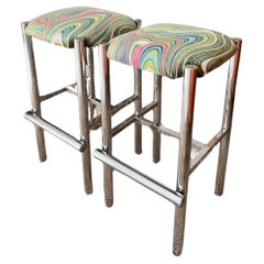 A set of 2 sleek Cal-Style chrome stools reupholstered in a groovy velvet