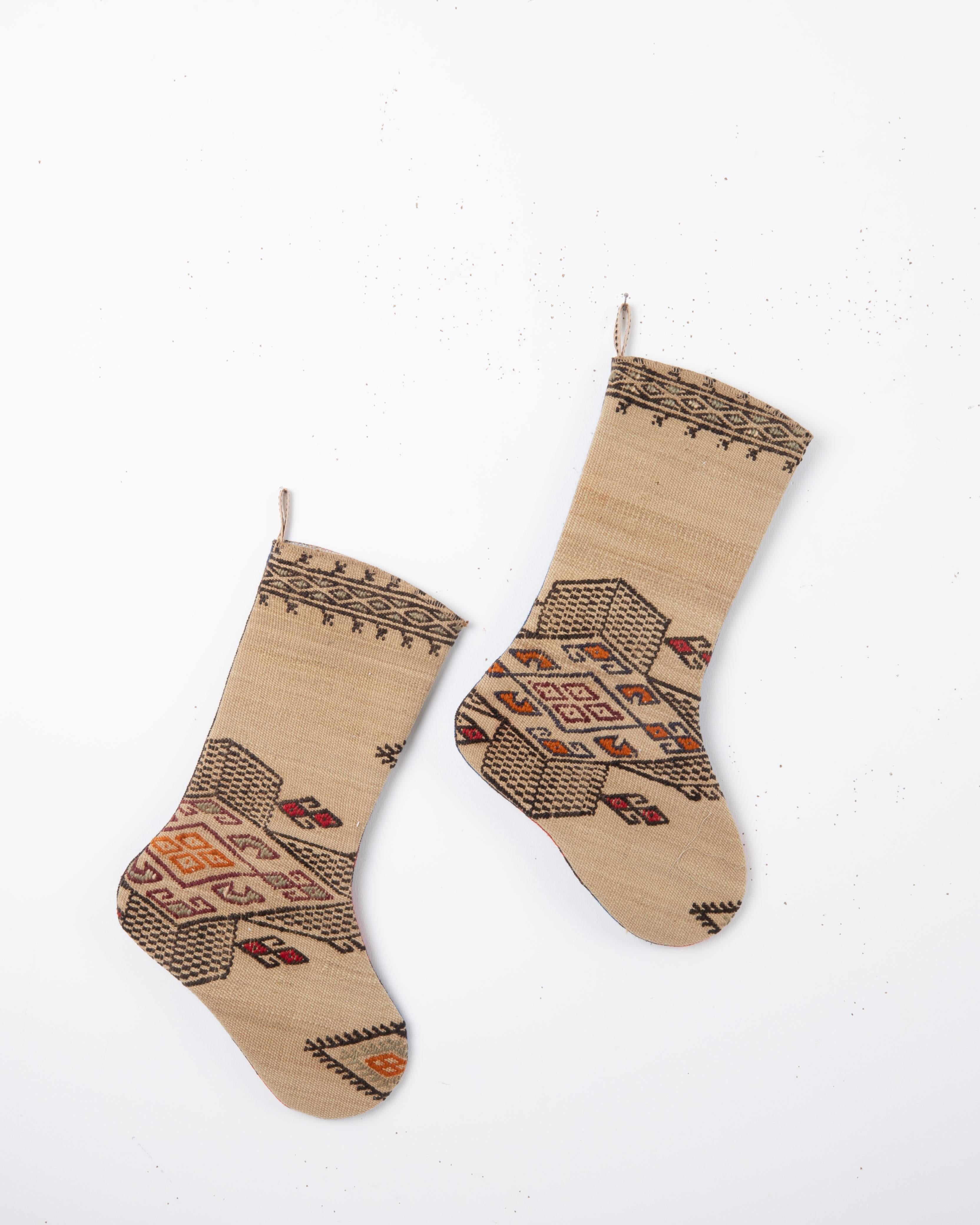 Each piece is one-of-a-kind, celebrating the artistry of traditional weaving while being repurposed into a festive and 
functional heirloom. Perfect for hanging by the fireplace, gifting, or adding a touch of vintage character to your seasonal