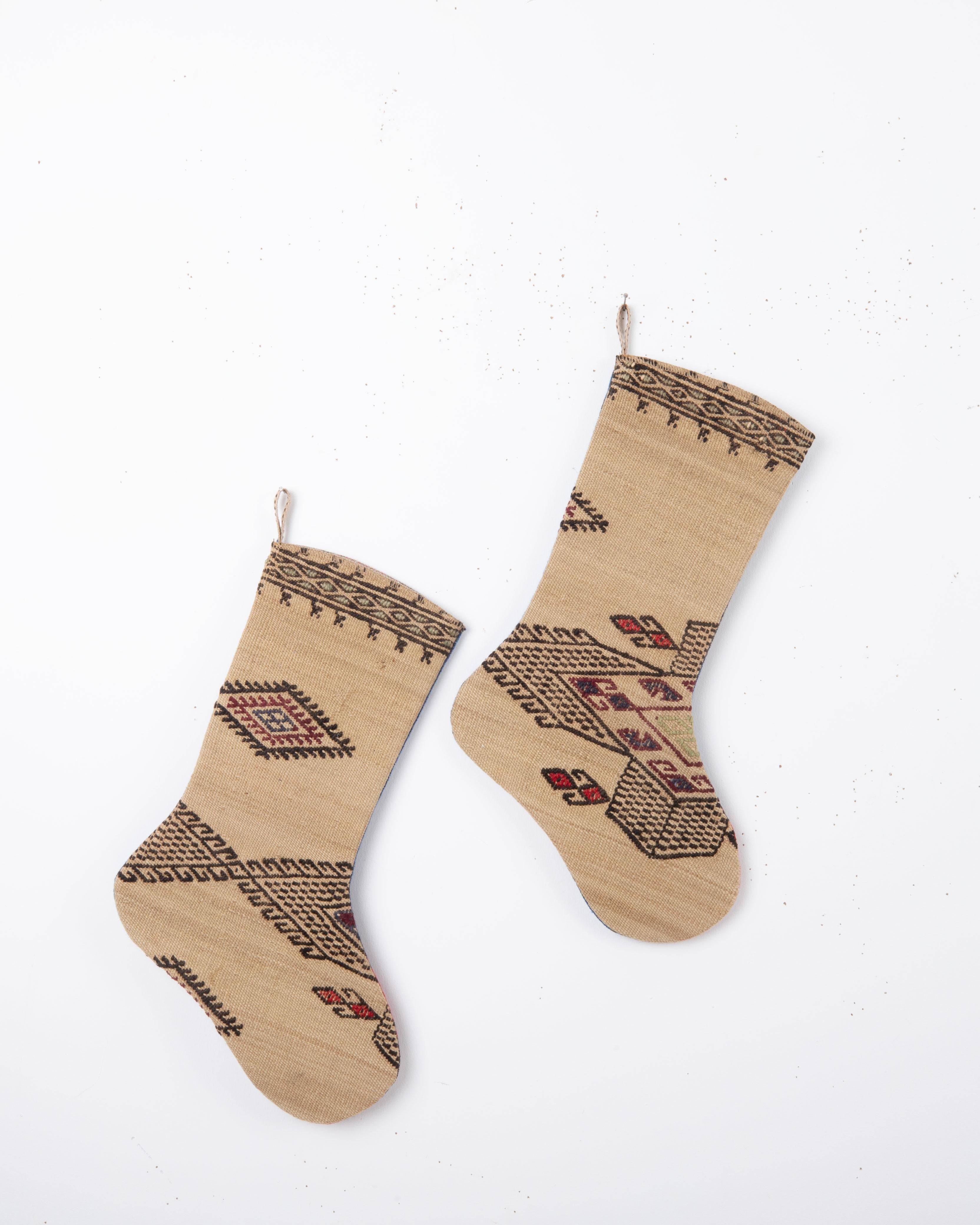 Each piece is one-of-a-kind, celebrating the artistry of traditional weaving while being repurposed into a festive and 
functional heirloom. Perfect for hanging by the fireplace, gifting, or adding a touch of vintage character to your seasonal