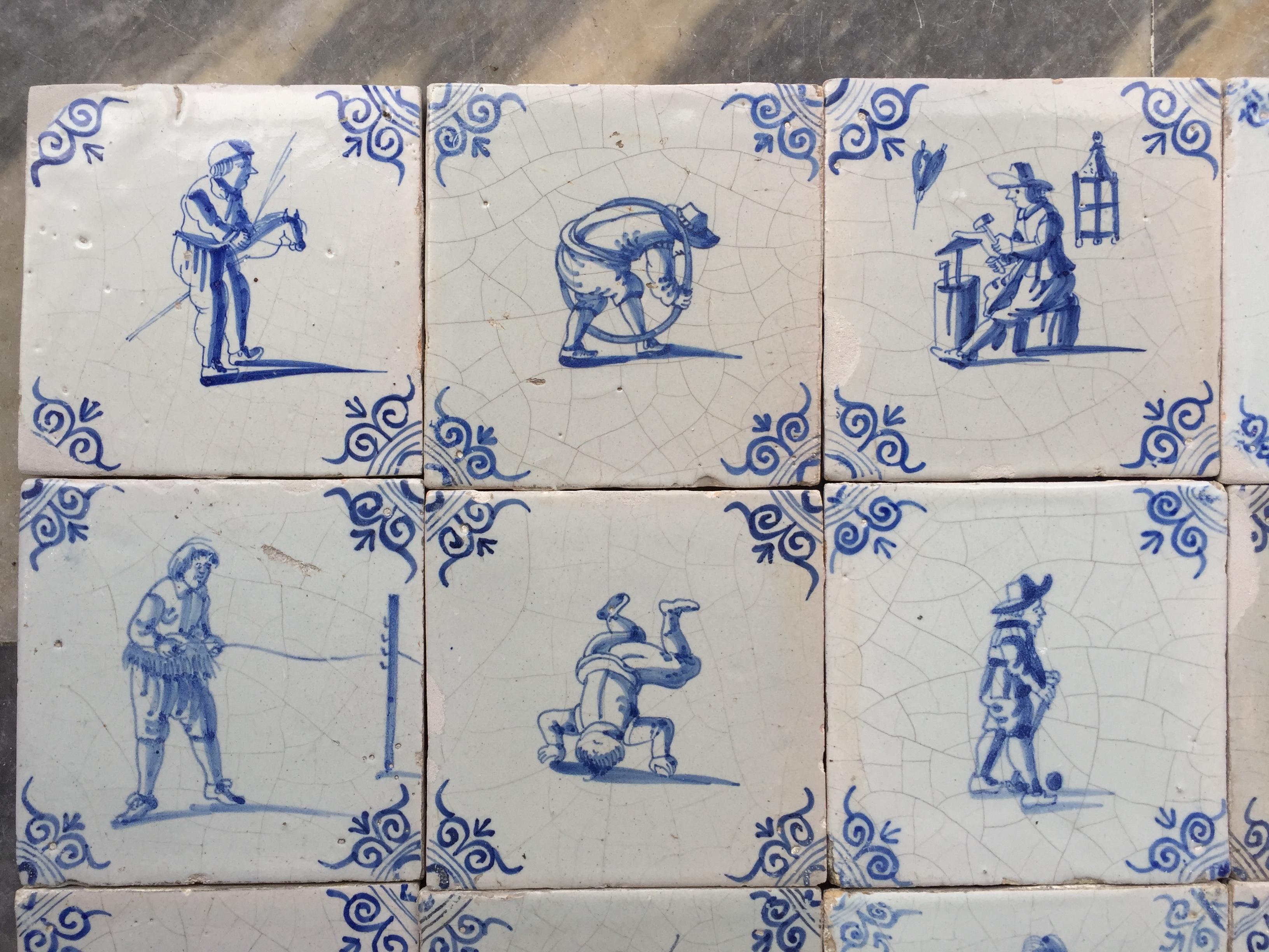 A set of 20 blue and white Dutch Delft tiles with figures and craftsmen. 
Made in The Netherlands.
Circa 1630 - 1660.

This set of tiles is of fine quality and has a bright glaze, characteristic for the tile production of the 17th century. Also, the