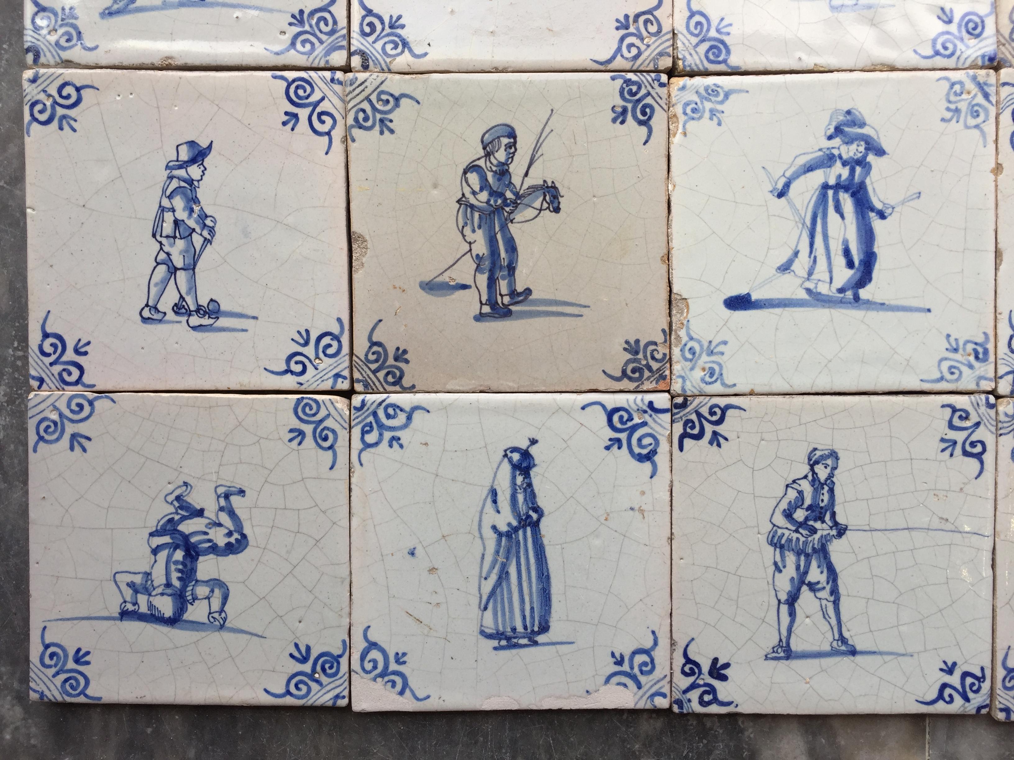 A set of 20 blue and white Dutch Delft tiles with figures and craftsmen In Good Condition In AMSTERDAM, NH