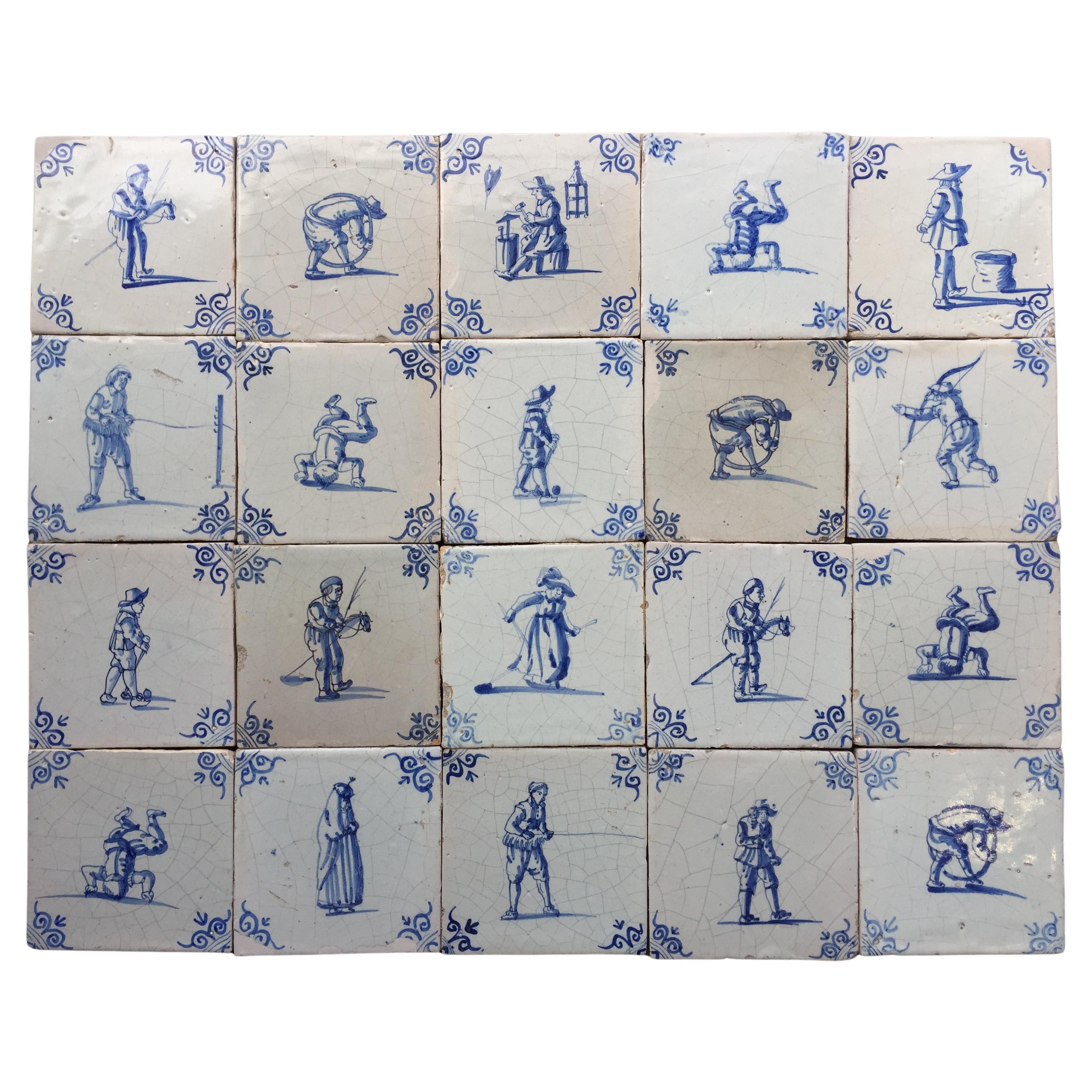 A set of 20 blue and white Dutch Delft tiles with figures and craftsmen