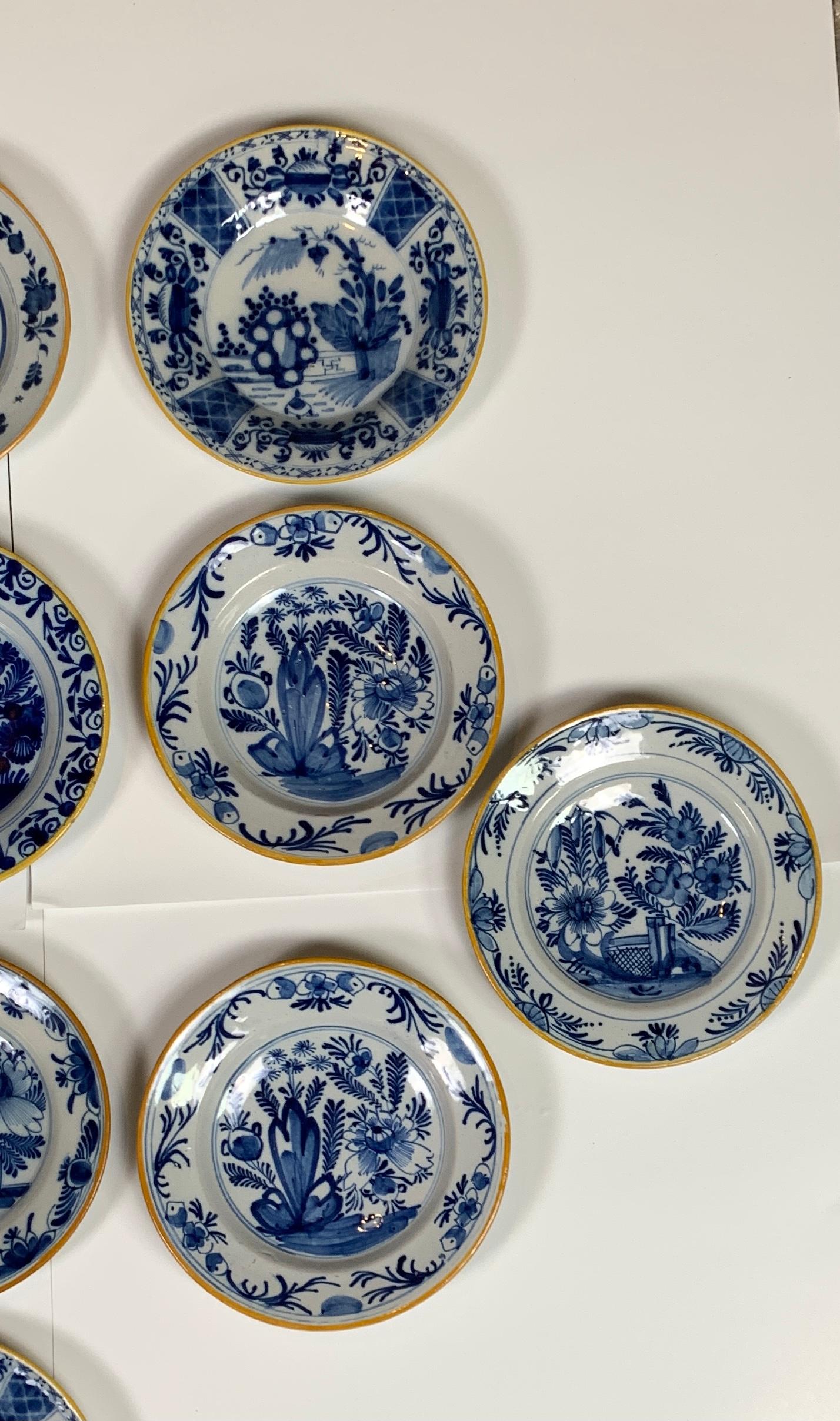 Hand-Painted Set of 21 Dutch Delft Plates Made, circa 1770-1810